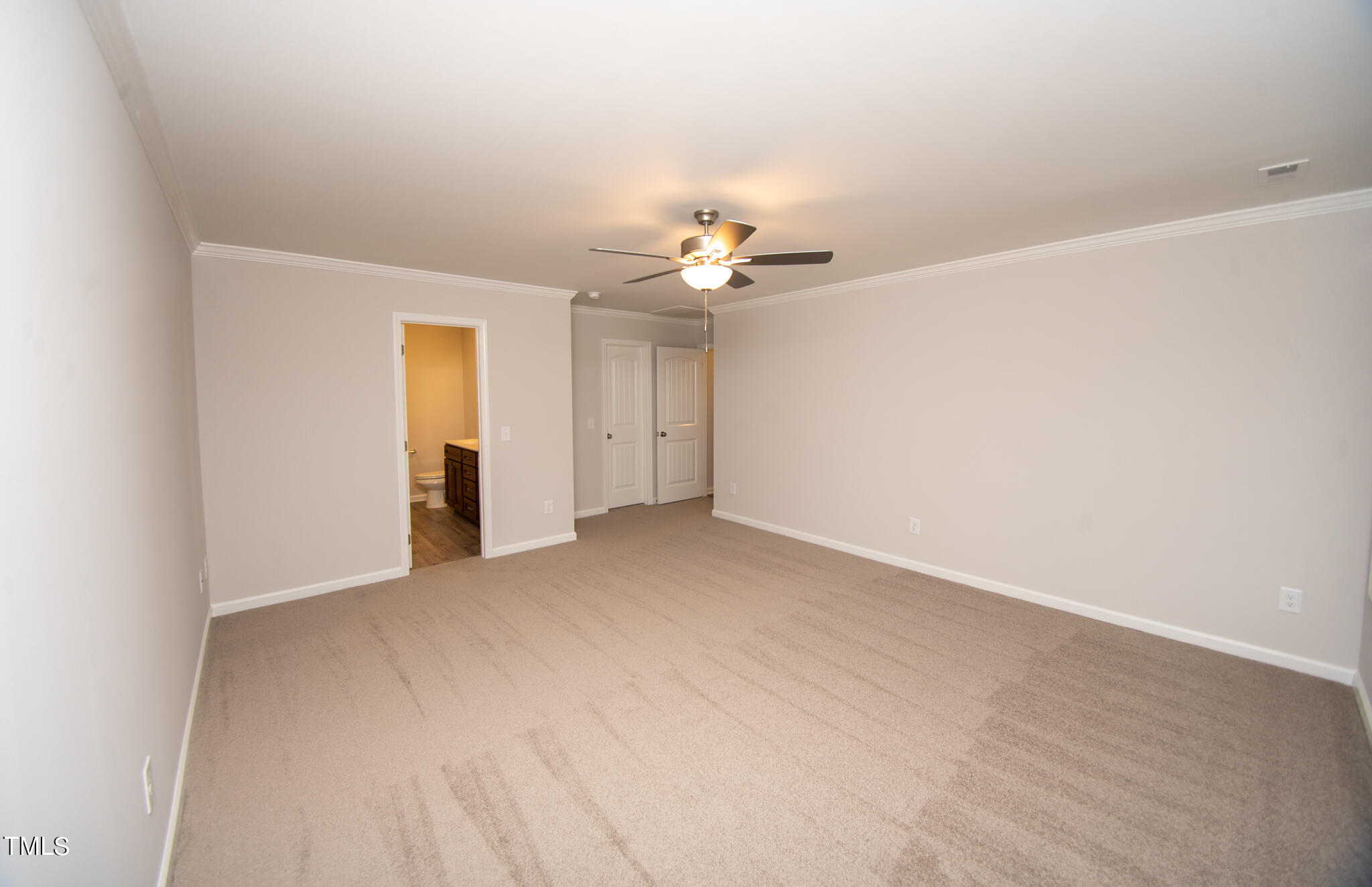 243 Waters Edge Drive Erwin, NC 28339 - Photo 18 of 53 a view of an empty room with a ceiling fan