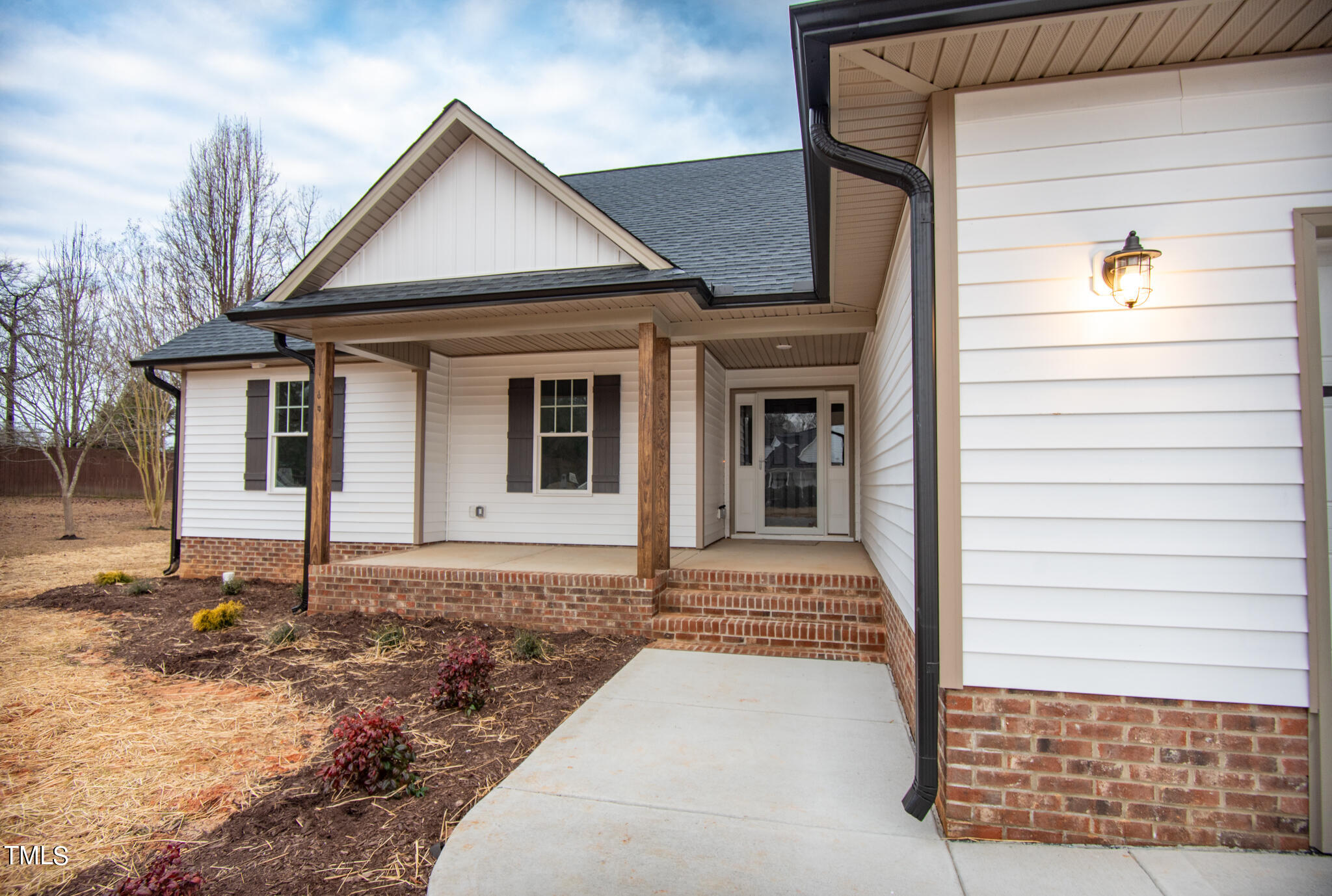 243 Waters Edge Drive Erwin, NC 28339 - Photo 2 of 53 a front view of a house with a yard