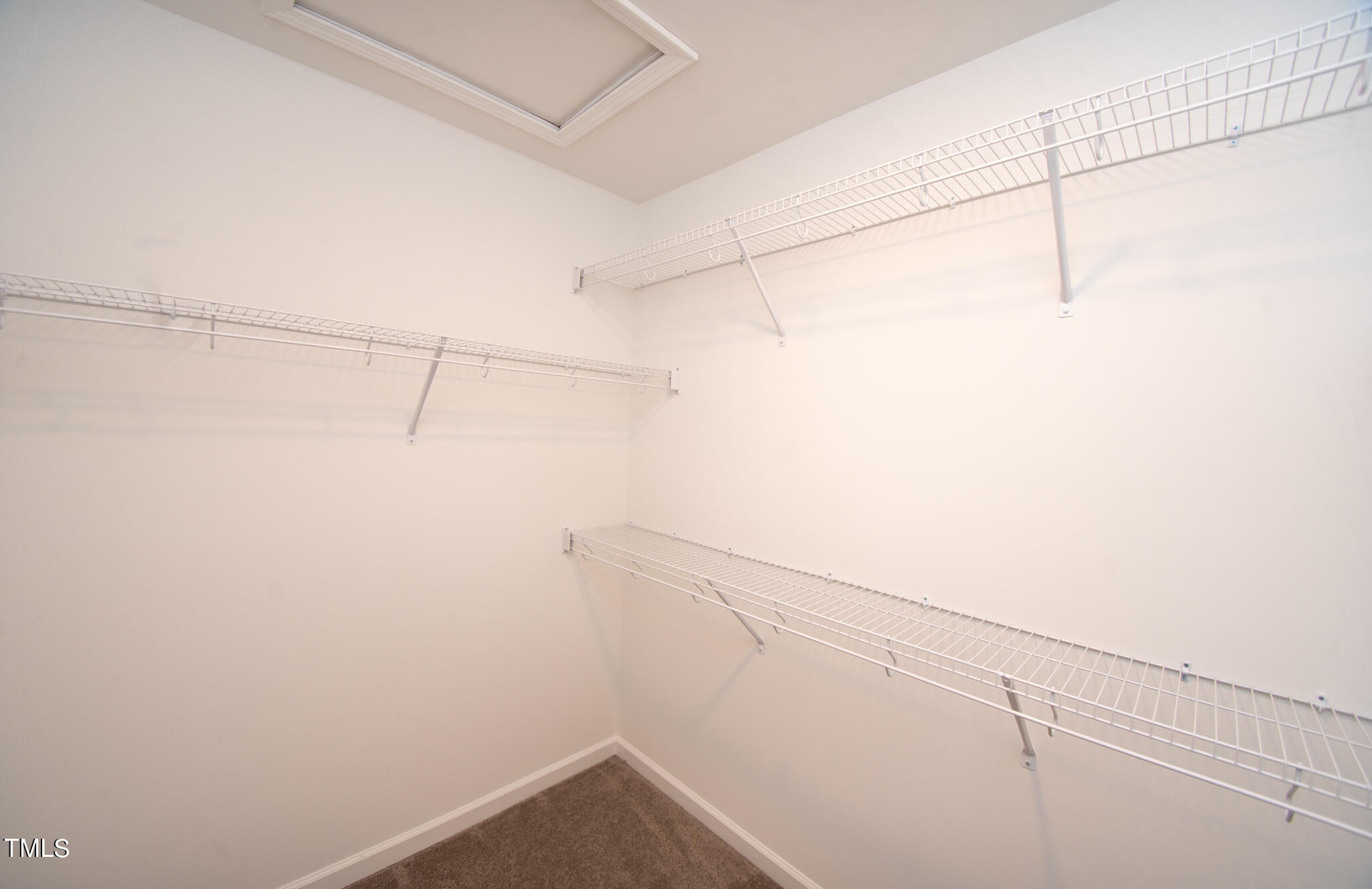 243 Waters Edge Drive Erwin, NC 28339 - Photo 28 of 53 a view of a room with racks on the wall