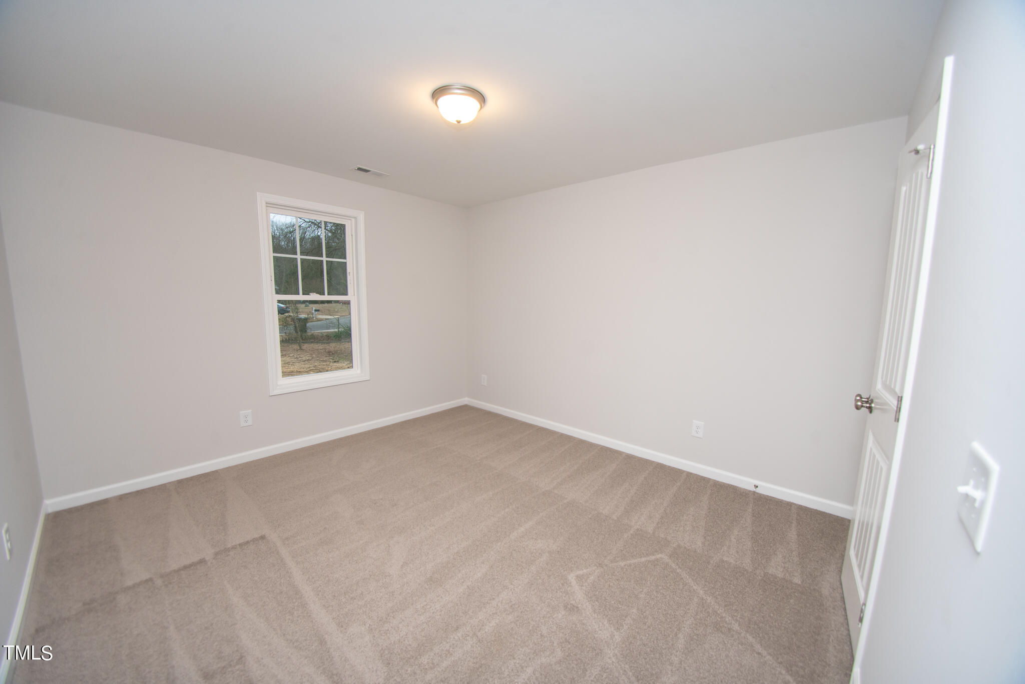 243 Waters Edge Drive Erwin, NC 28339 - Photo 33 of 53 an empty room with a window