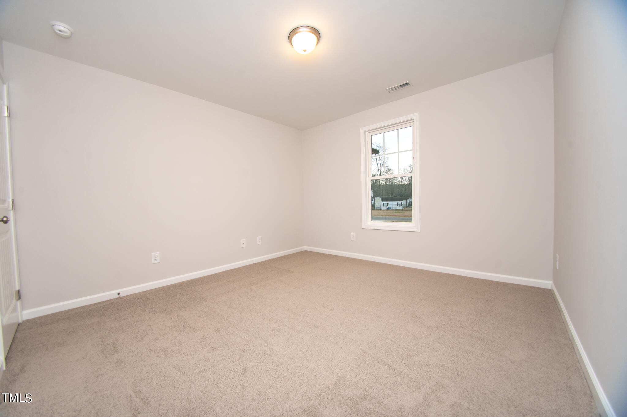 243 Waters Edge Drive Erwin, NC 28339 - Photo 35 of 53 an empty room with a window