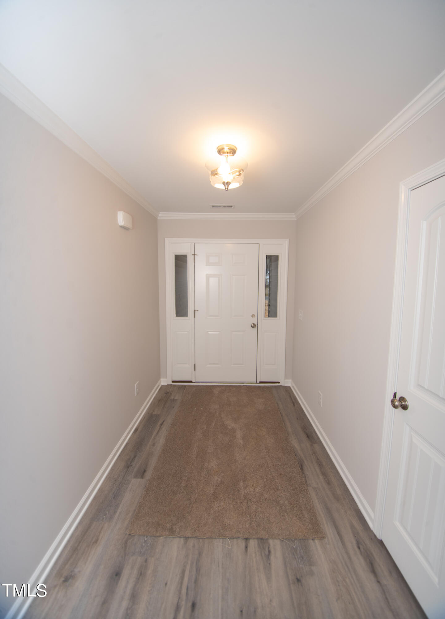243 Waters Edge Drive Erwin, NC 28339 - Photo 41 of 53 wooden floor in an empty room with a window