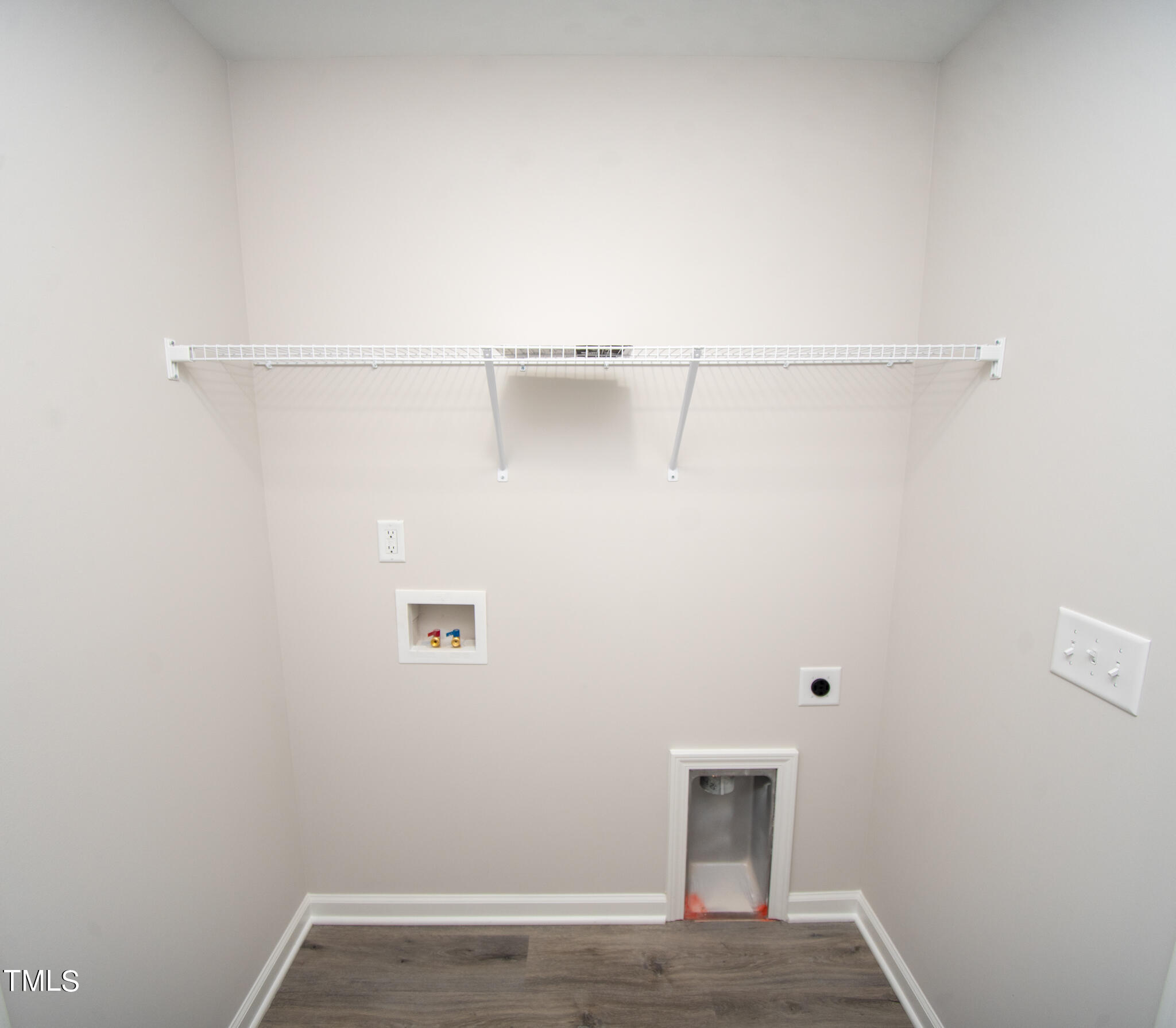 243 Waters Edge Drive Erwin, NC 28339 - Photo 42 of 53 a view of a room with racks on the wall