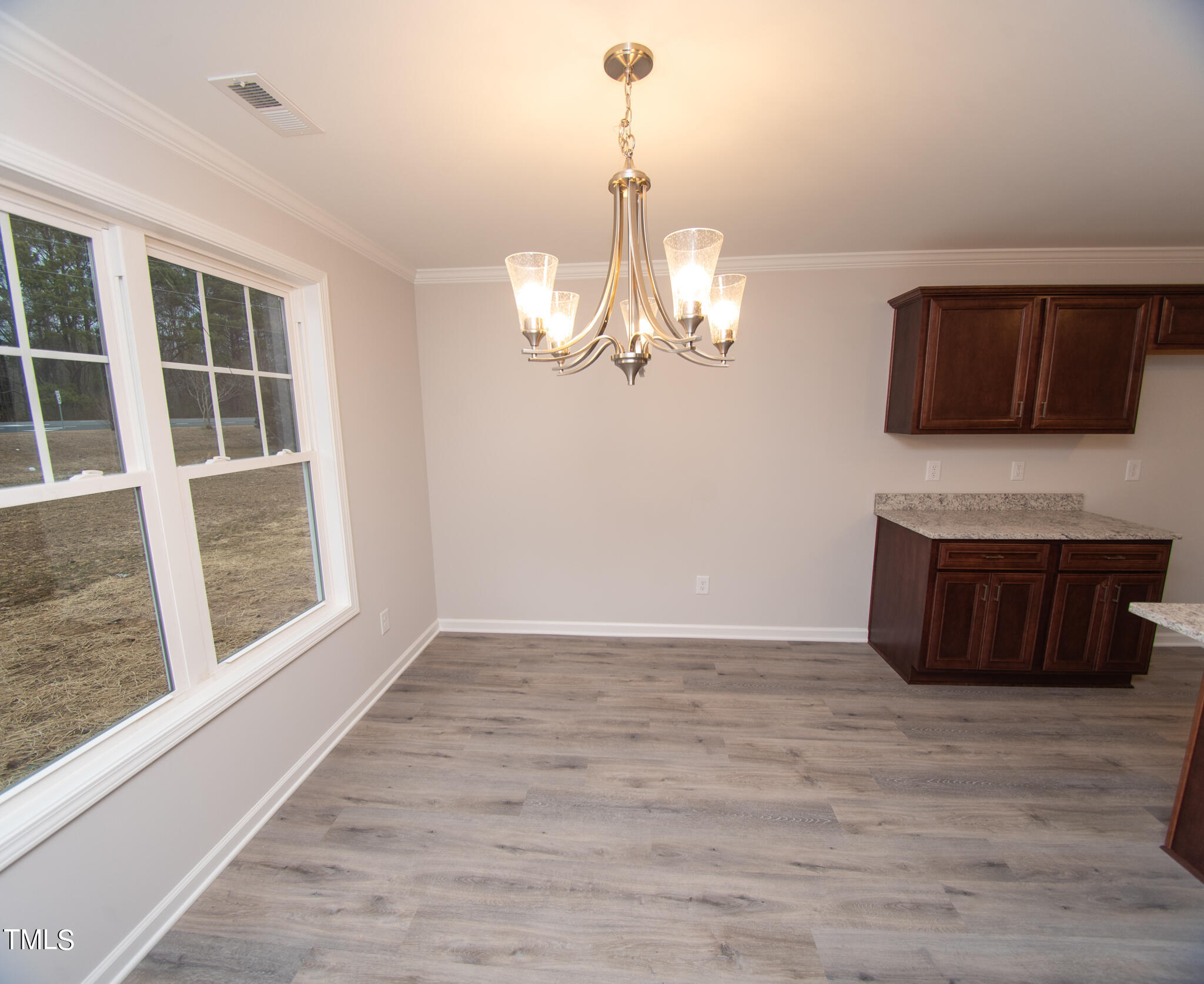 243 Waters Edge Drive Erwin, NC 28339 - Photo 8 of 53 a view of a livingroom with furniture wooden floor window and fireplace