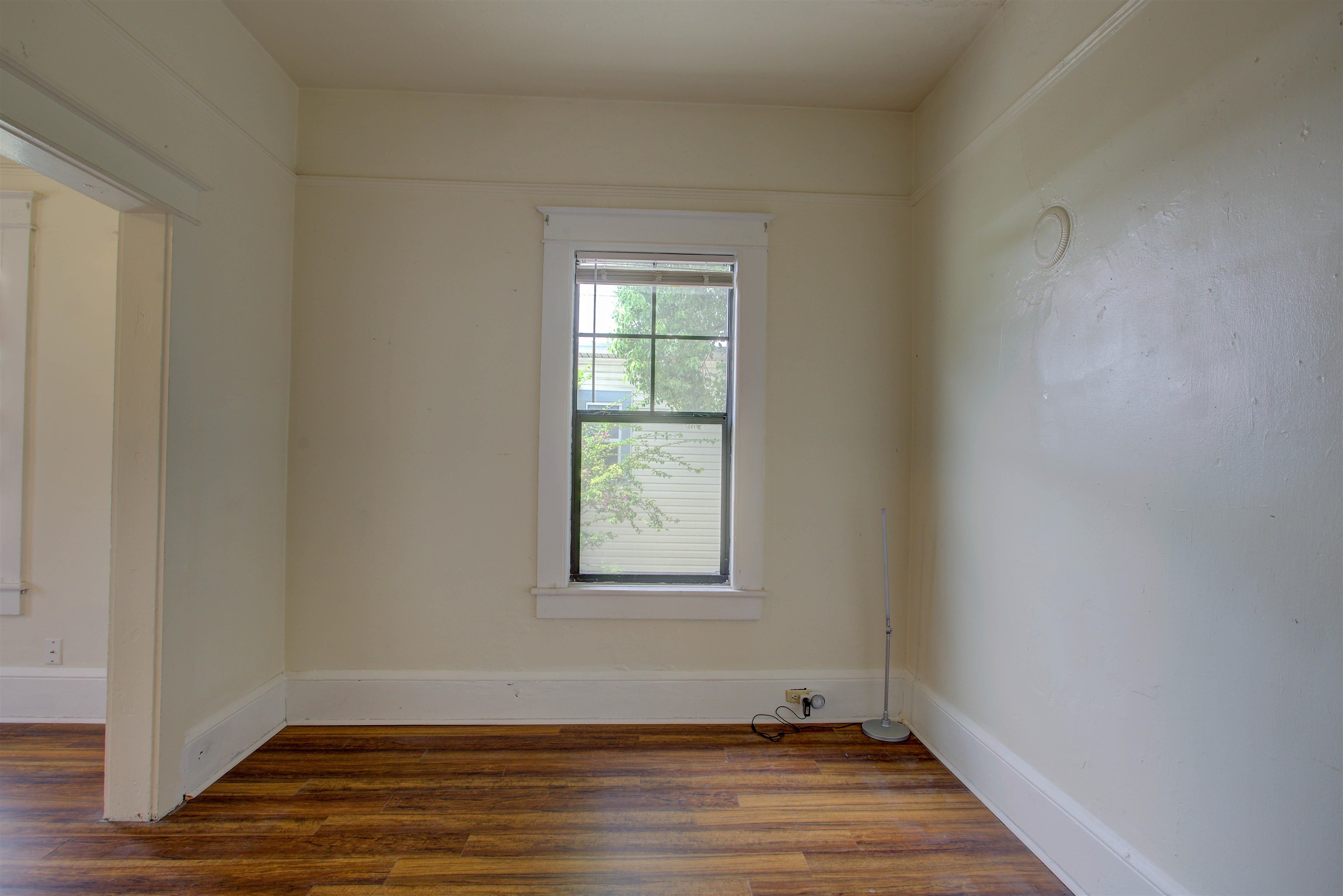 20 Hope Street St. Augustine, FL 32084 - Photo 11 of 35 a view of an empty room with wooden floor and a window