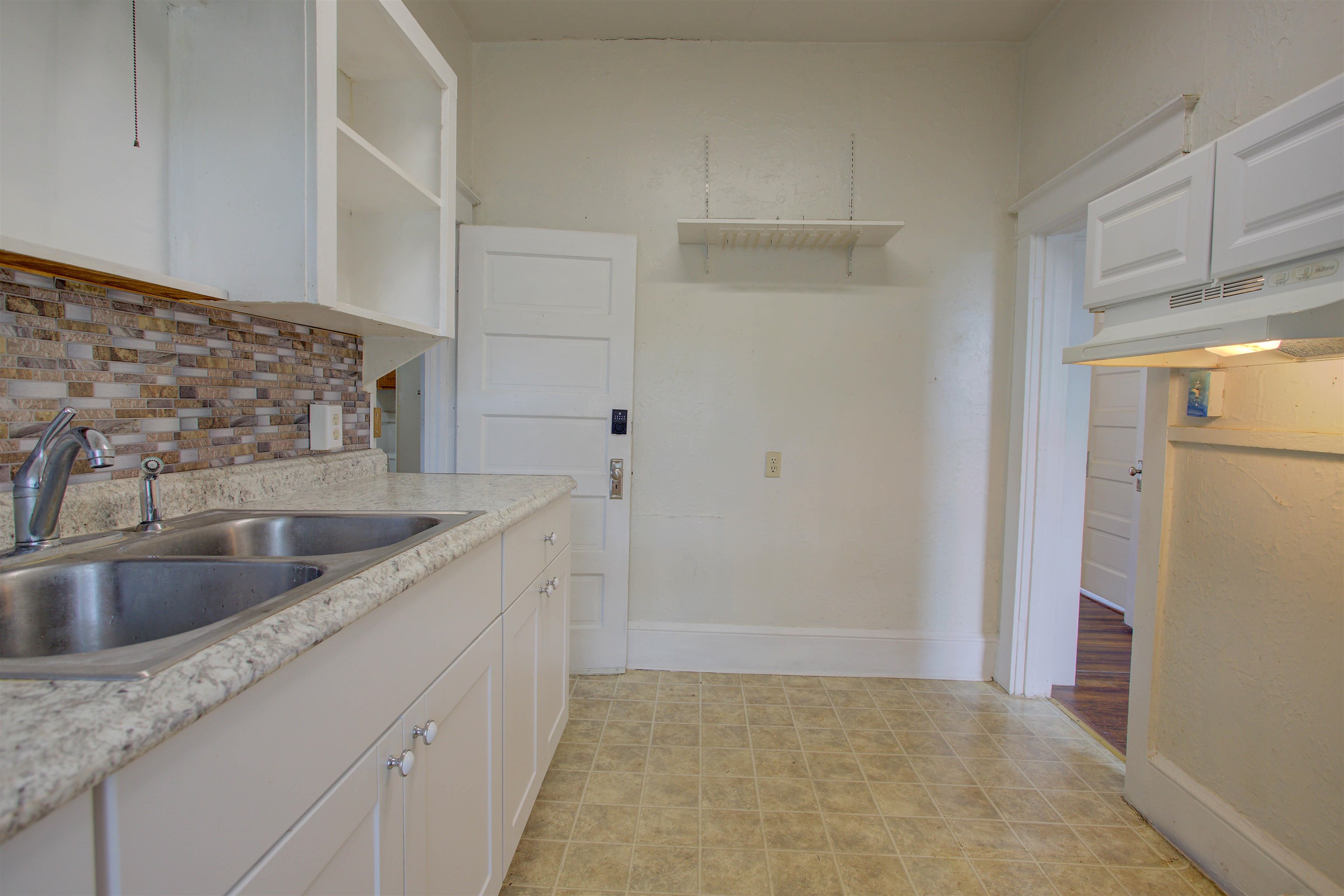 20 Hope Street St. Augustine, FL 32084 - Photo 13 of 35 a kitchen with a sink and refrigerator