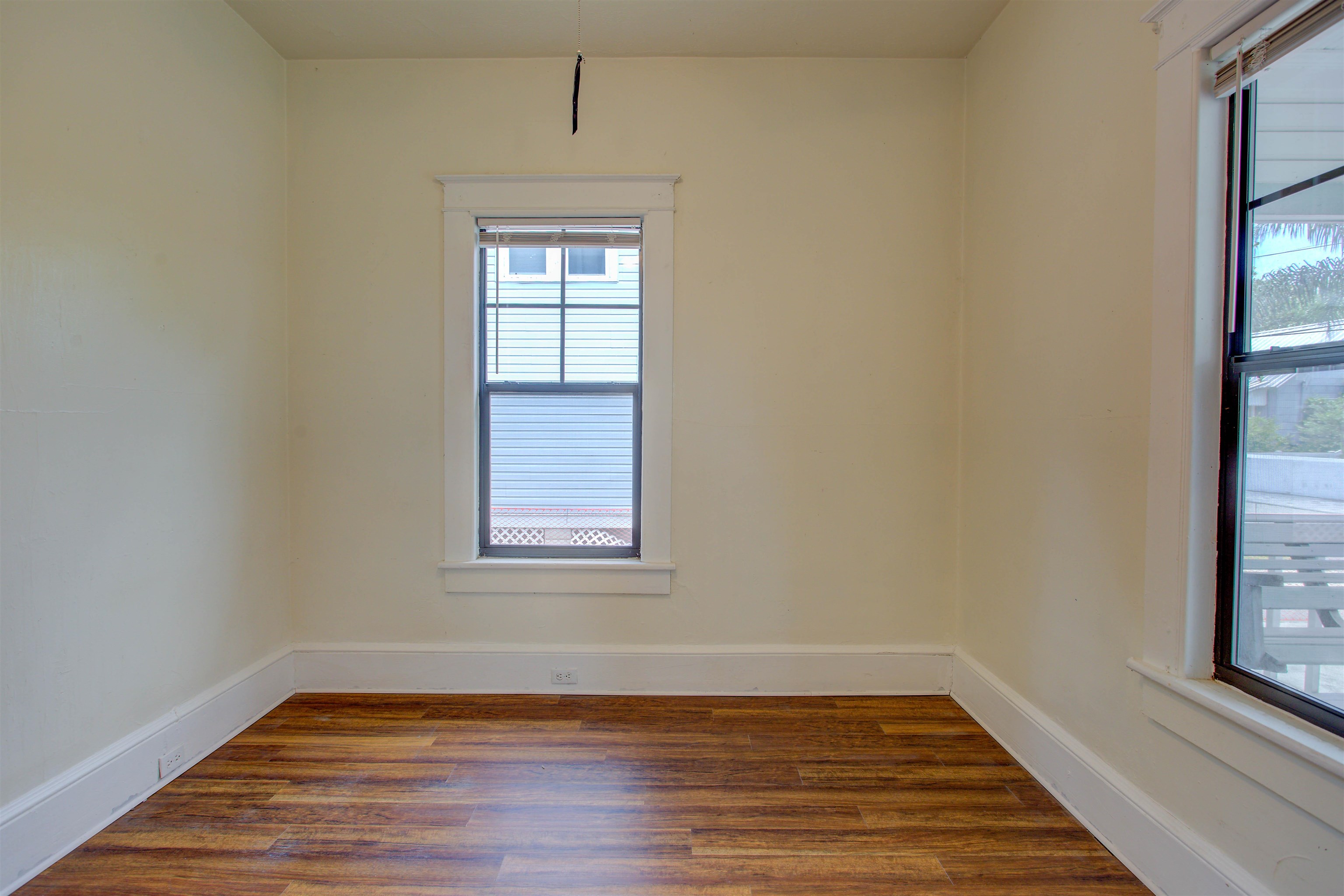 20 Hope Street St. Augustine, FL 32084 - Photo 15 of 35 a view of an empty room with wooden floor and a window