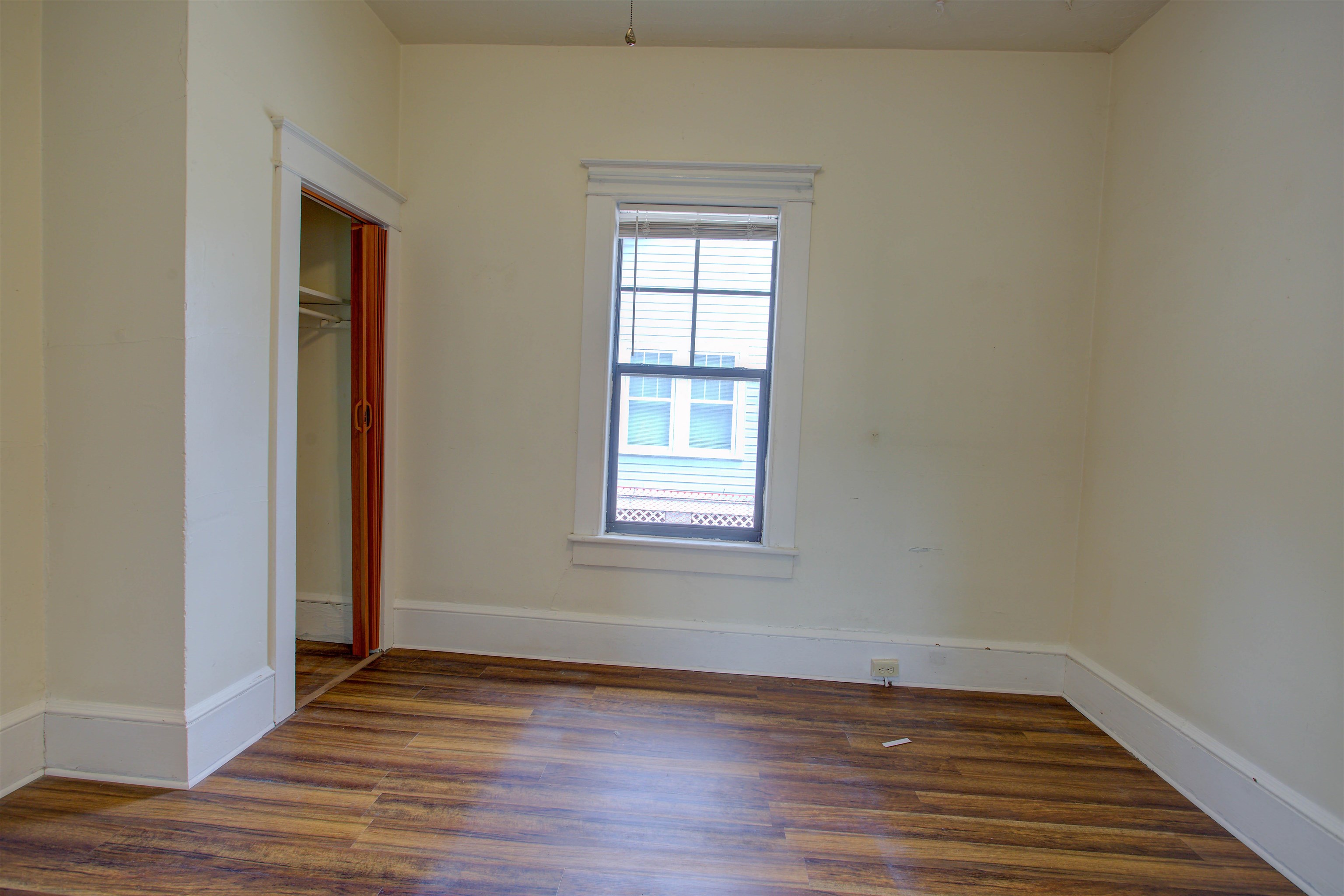 20 Hope Street St. Augustine, FL 32084 - Photo 18 of 35 a view of an empty room with wooden floor and a window