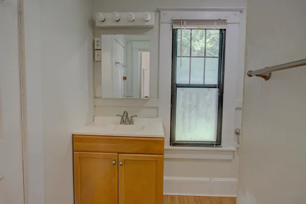 a bathroom with a sink a vanity and a mirror