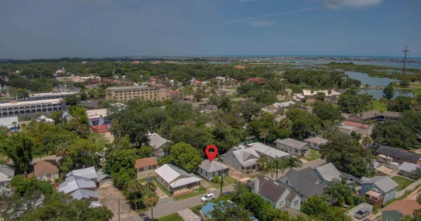 an aerial view of residential house and lake