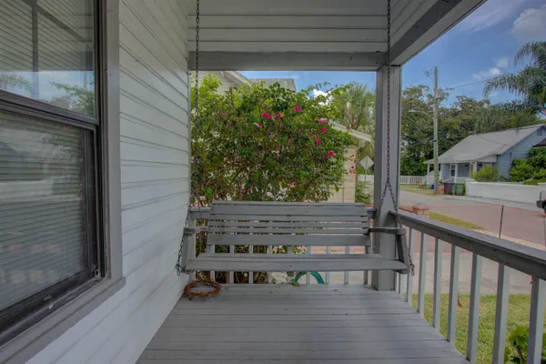 a view of two chairs in a balcony