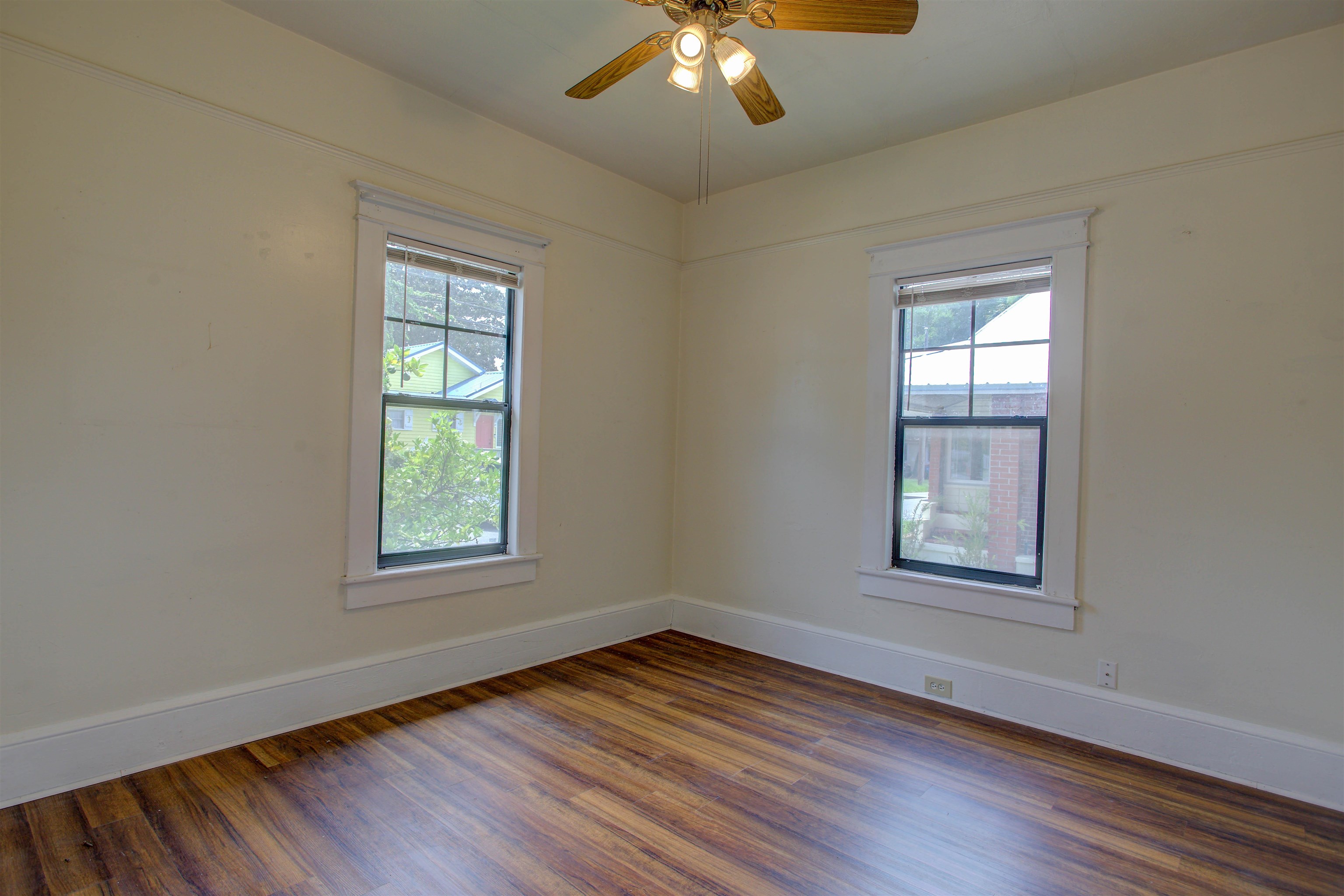 20 Hope Street St. Augustine, FL 32084 - Photo 6 of 35 an empty room with wooden floor chandelier and windows