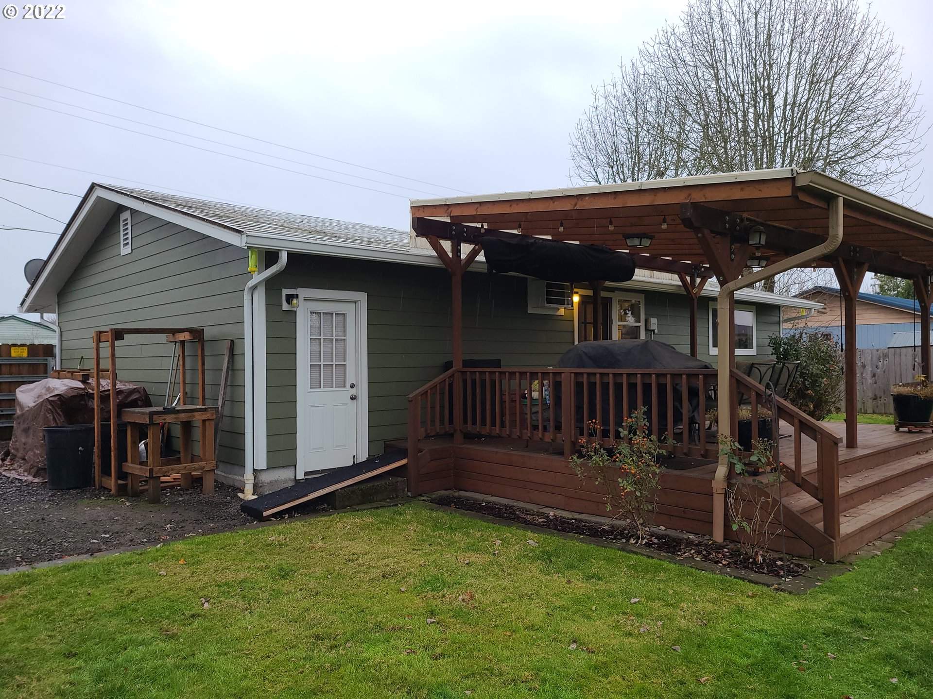 410 40th Street Springfield, OR 97478 - Photo 22 of 28 a view of backyard with deck and tub