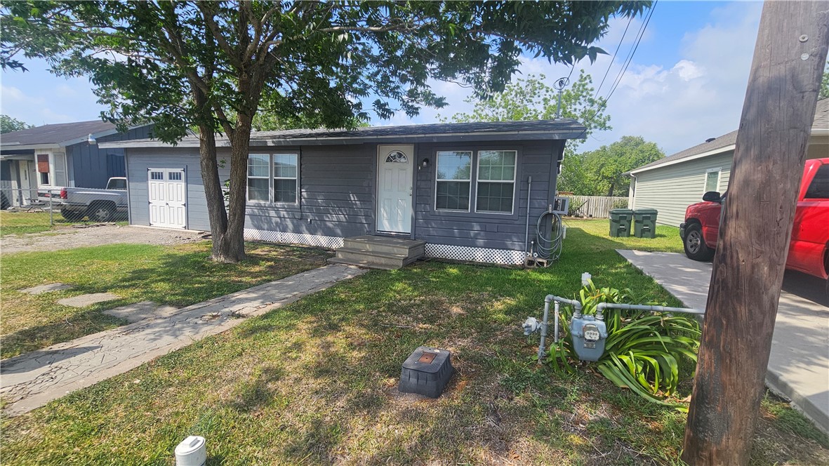 131 Algodon Street Taft, TX 78390 - Photo 3 of 10 front view of a house with a yard