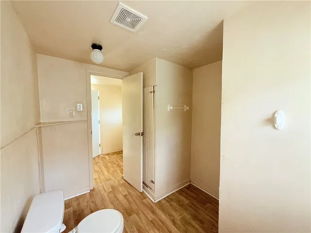 a backyard of a house with lots of green space and fountain