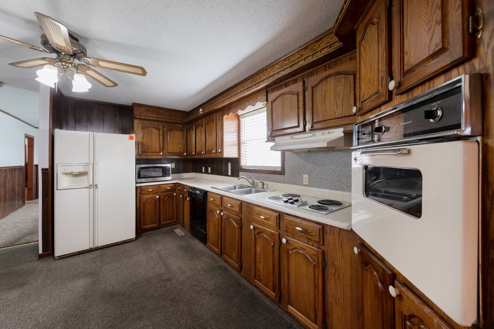 1036 Rabbit Trail Road Five Points, TN 38457 - Photo 17 of 53 a kitchen with stainless steel appliances granite countertop a stove sink microwave and cabinets