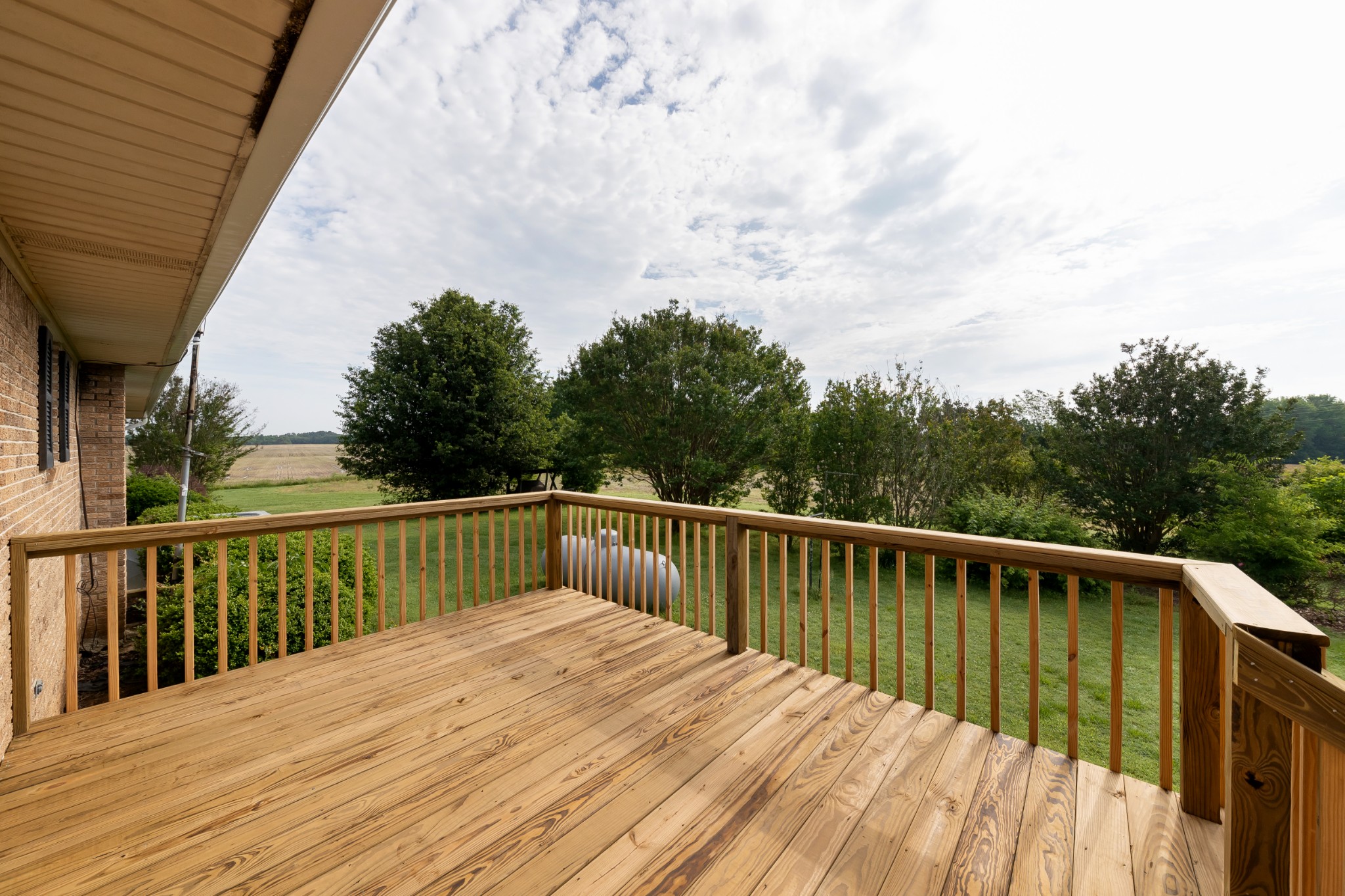 1036 Rabbit Trail Road Five Points, TN 38457 - Photo 4 of 53 a balcony with wooden floor and fence