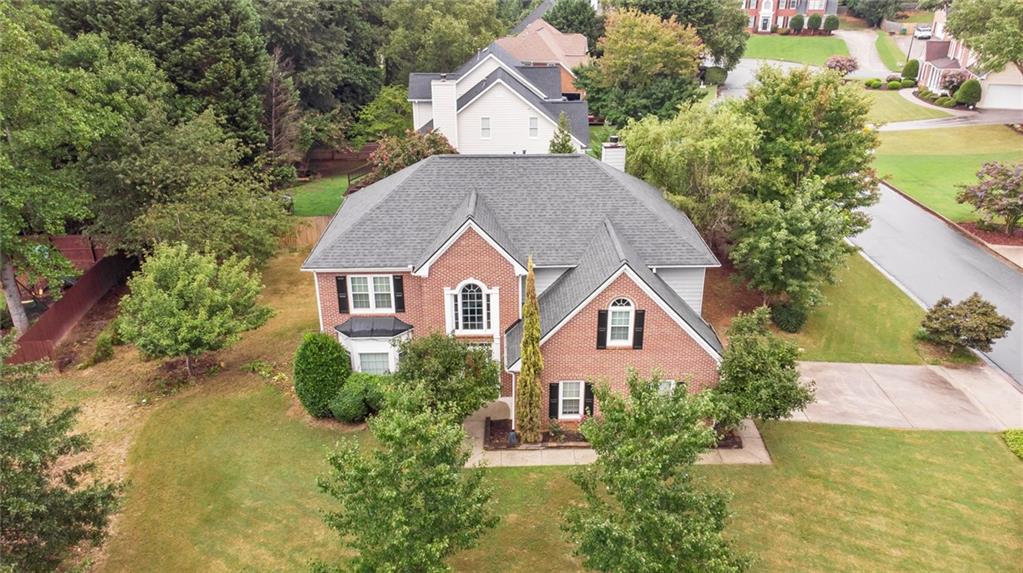 4175 Bridlegate Way Snellville, GA 30039 - Photo 1 of 1 a view of a house with brick walls and trees