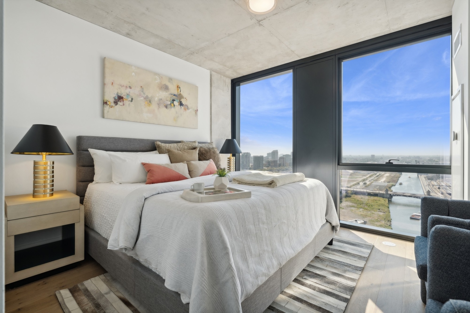 234 West Polk Street, Unit 3101 Chicago, IL 60605 - Photo 13 of 36 a bed room with a bed and a painting on the wall