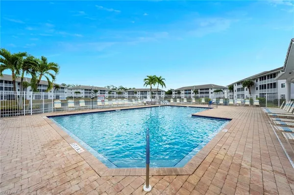 a view of swimming pool from a balcony