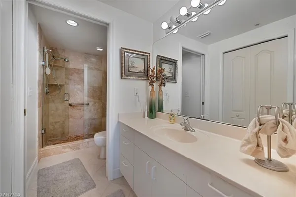 a bathroom with a sink tub and shower