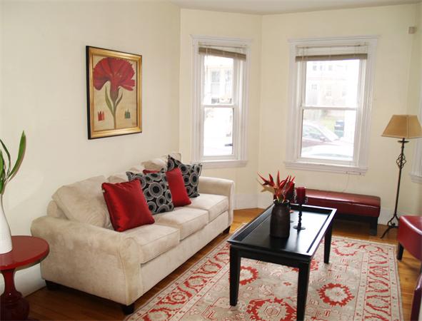 a living room with furniture and a window
