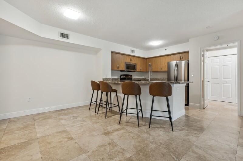 3131 Clint Moore Road, Unit 105 Boca Raton, FL 33496 - Photo 11 of 20 07_3131CLINTMOORERDUNIT105_191_KitchenBr
