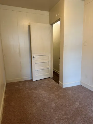 a view of a house with pool and sitting area
