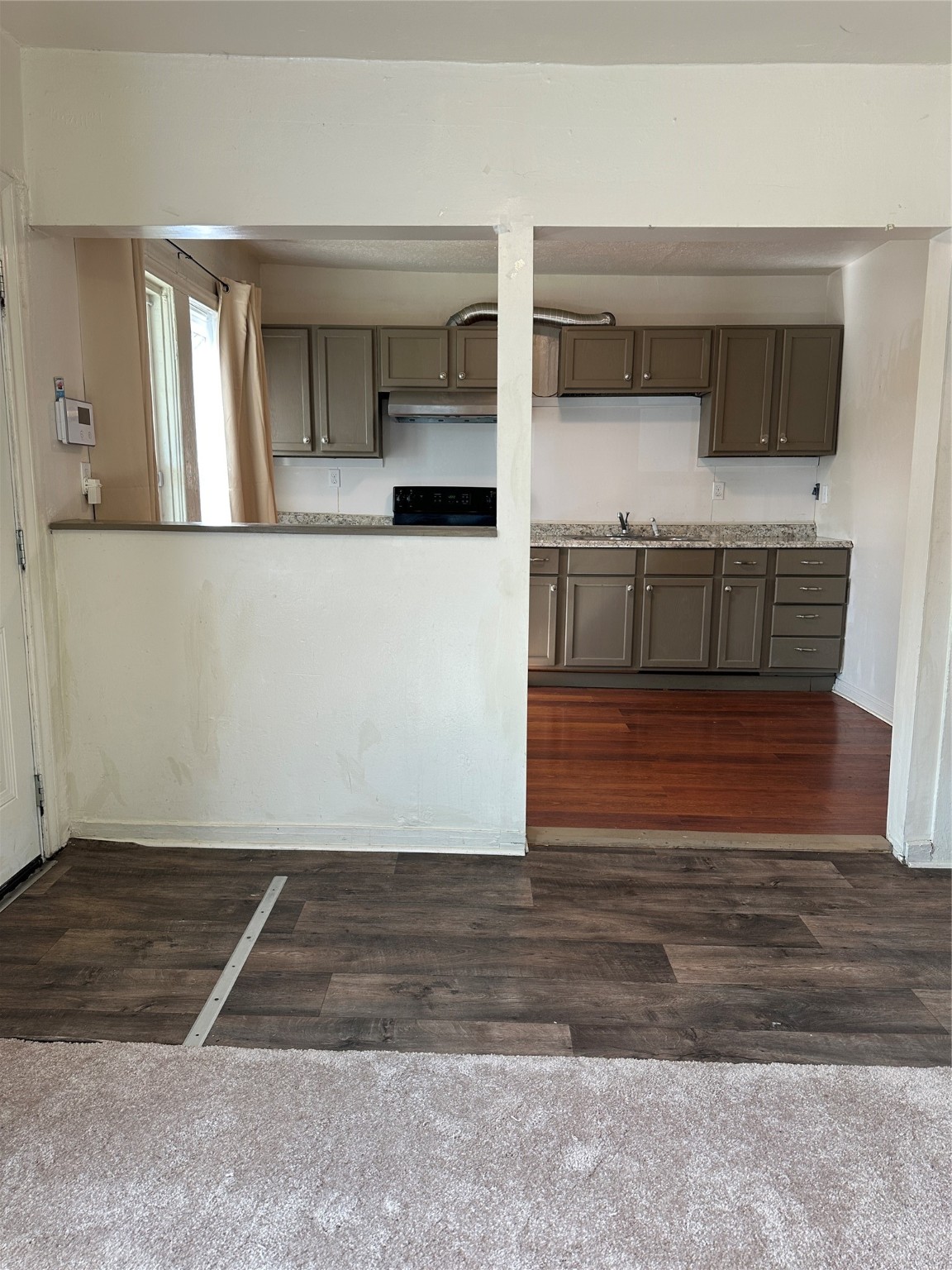1125 East 27th Street Houston, TX 77009 - Photo 7 of 16 View from Living Room to kitchen.