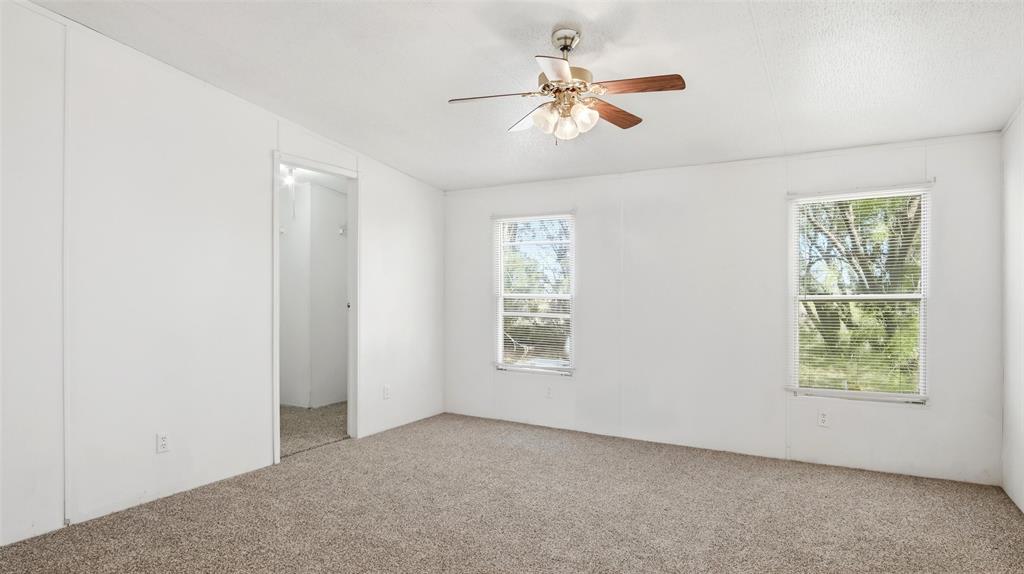 10902 County Road 414 Merkel, TX 79536 - Photo 16 of 26 an empty room with windows and fan