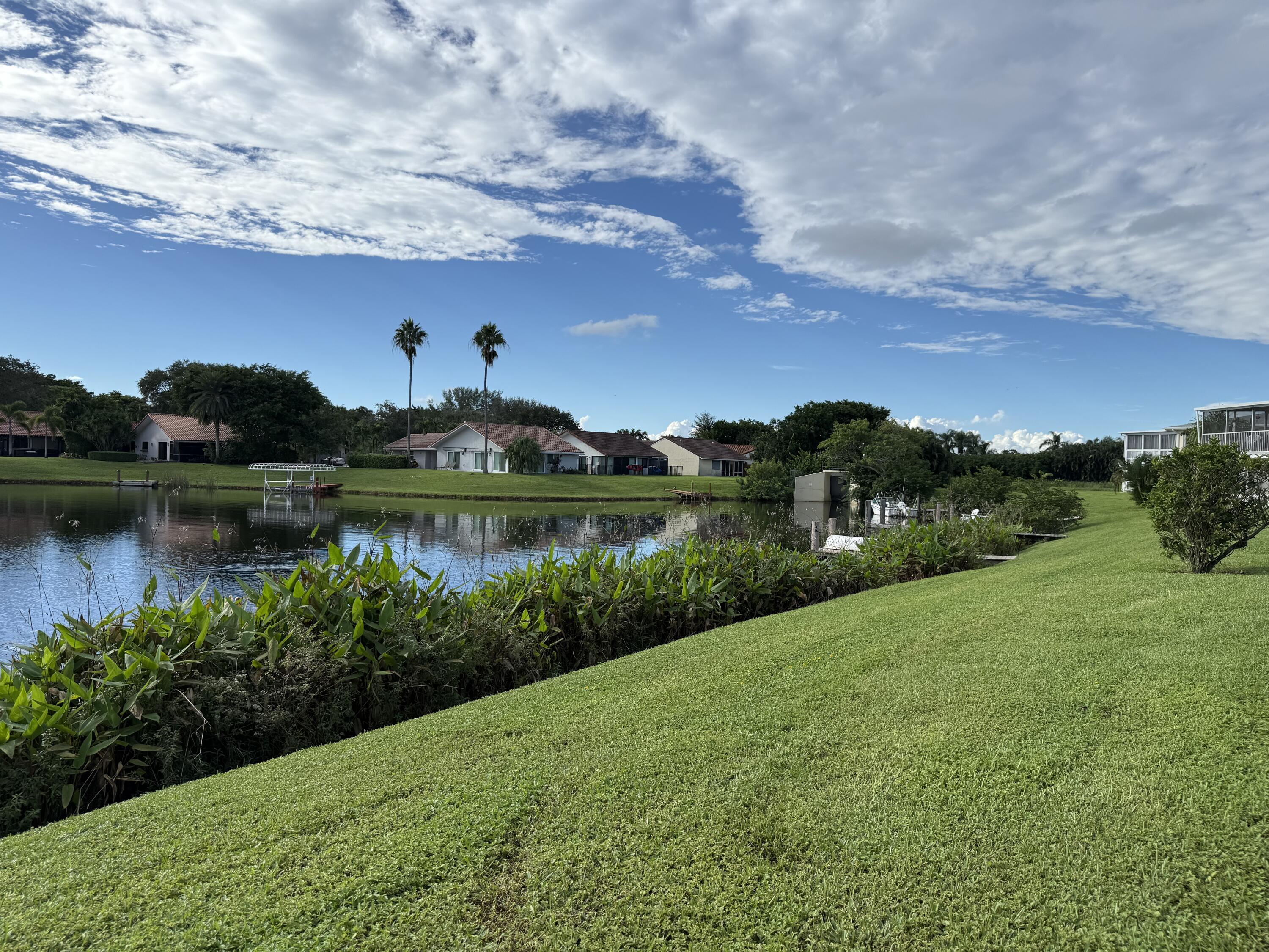 a view of a lake with houses in the back