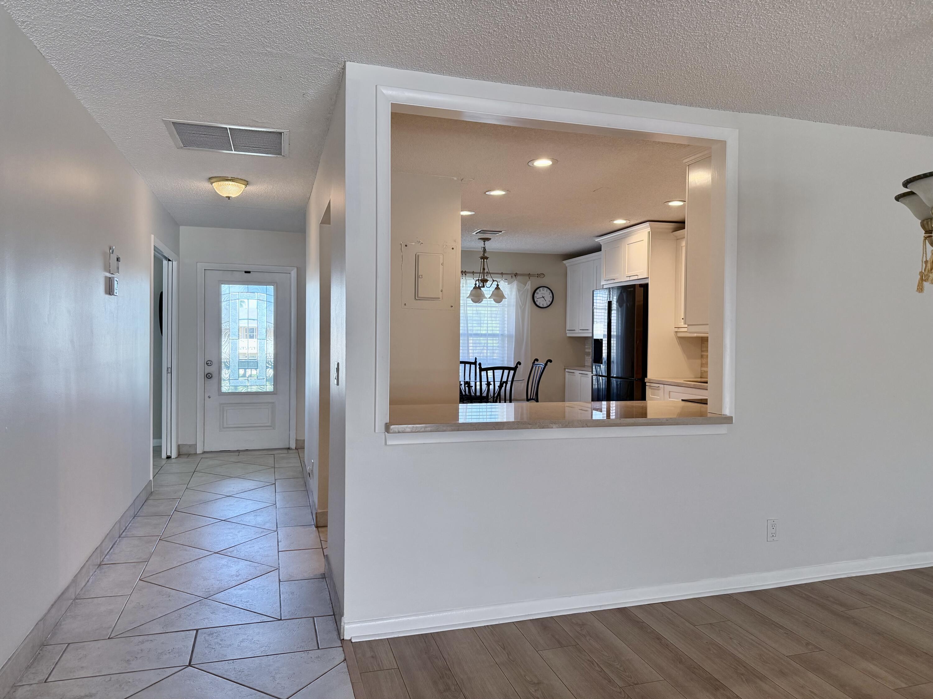 1720 Northwest 20th Avenue, Unit 204 Delray Beach, FL 33445 - Photo 14 of 30 wooden floor in a kitchen