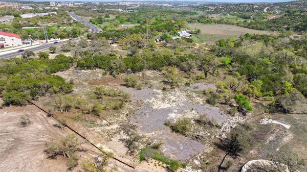 a view of a forest with a lake
