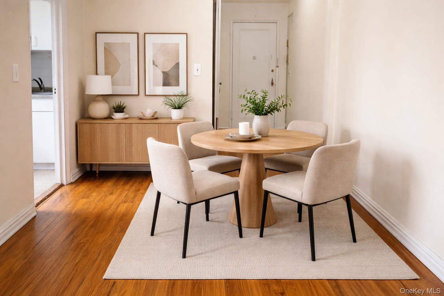 192 Garth Road, Unit 4N Scarsdale, NY 10583 - Photo 11 of 32 a dining room with furniture and wooden floor