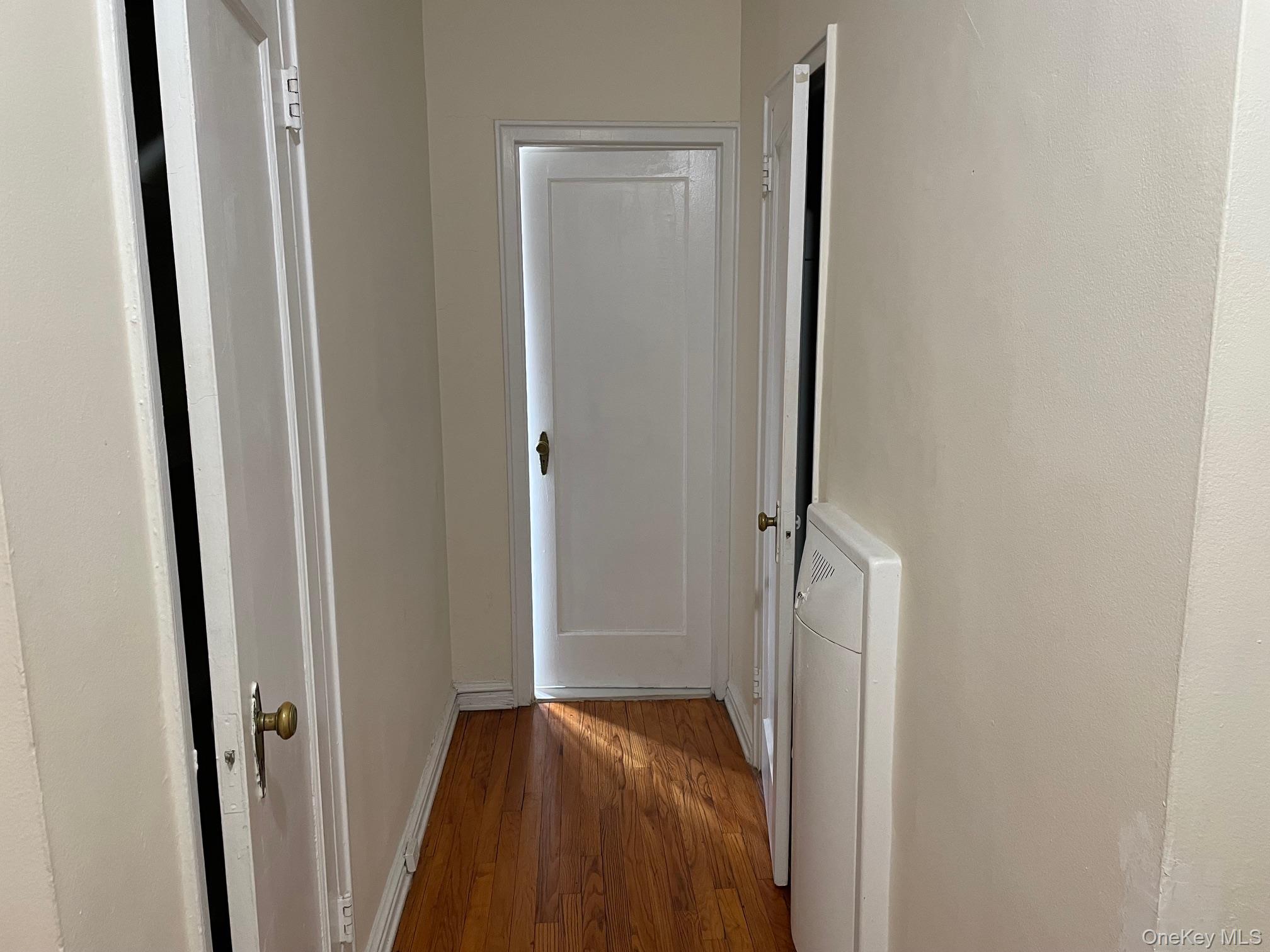192 Garth Road, Unit 4N Scarsdale, NY 10583 - Photo 20 of 32 a view of hallway with closet and wooden floor
