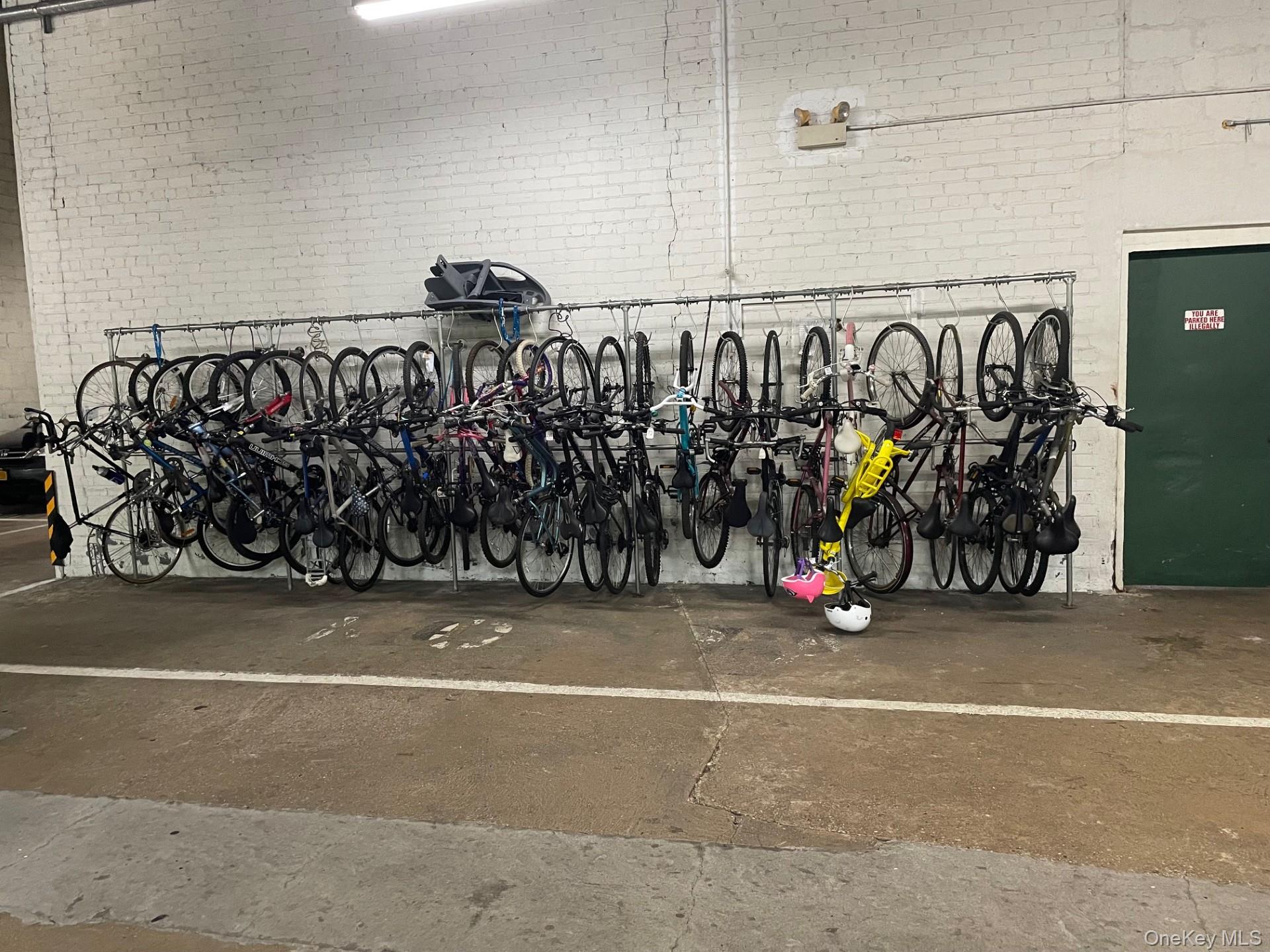 192 Garth Road, Unit 4N Scarsdale, NY 10583 - Photo 25 of 32 a view of a garage with rack and bicycle
