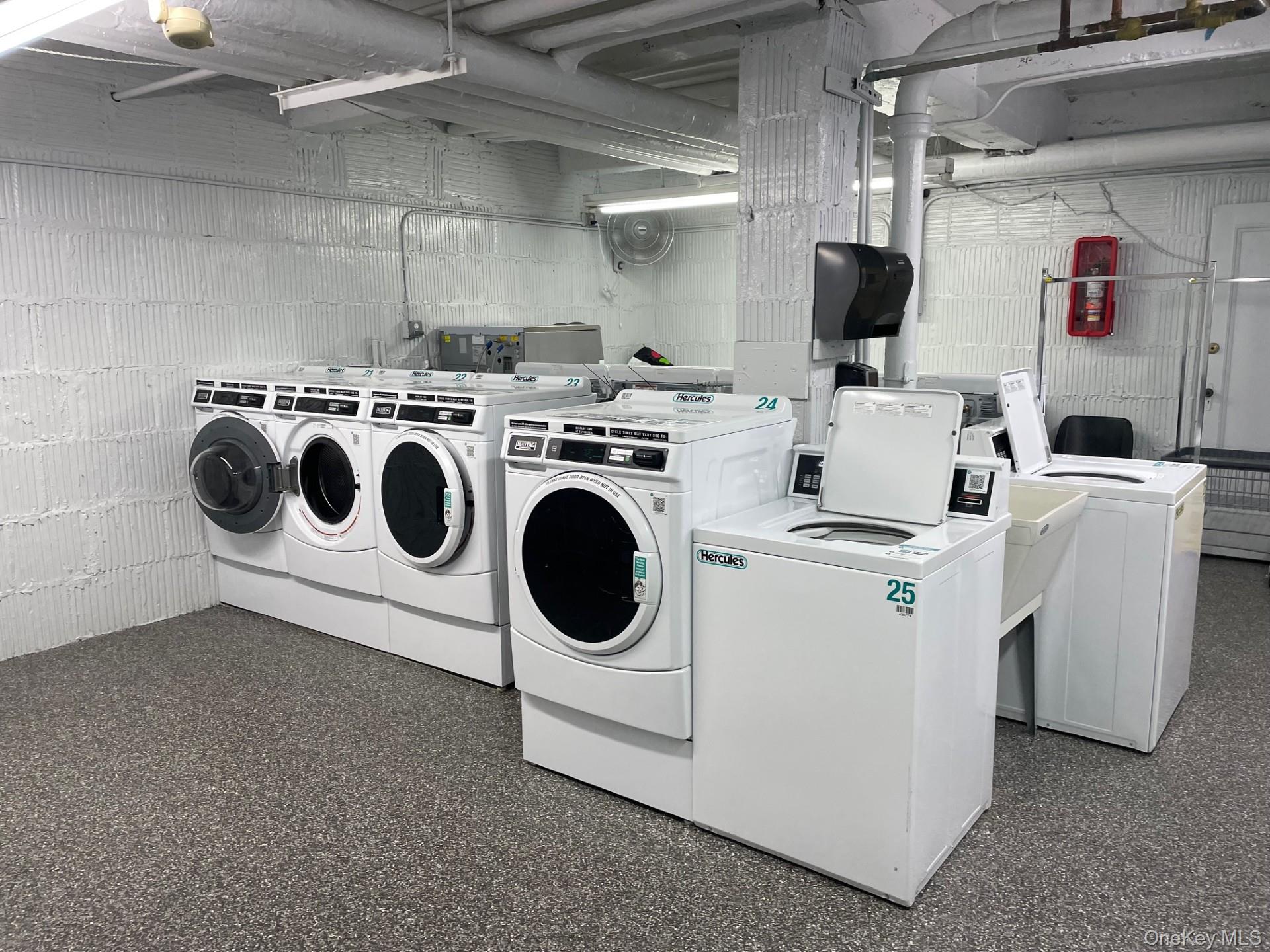 192 Garth Road, Unit 4N Scarsdale, NY 10583 - Photo 26 of 32 a utility room with dryer and washer