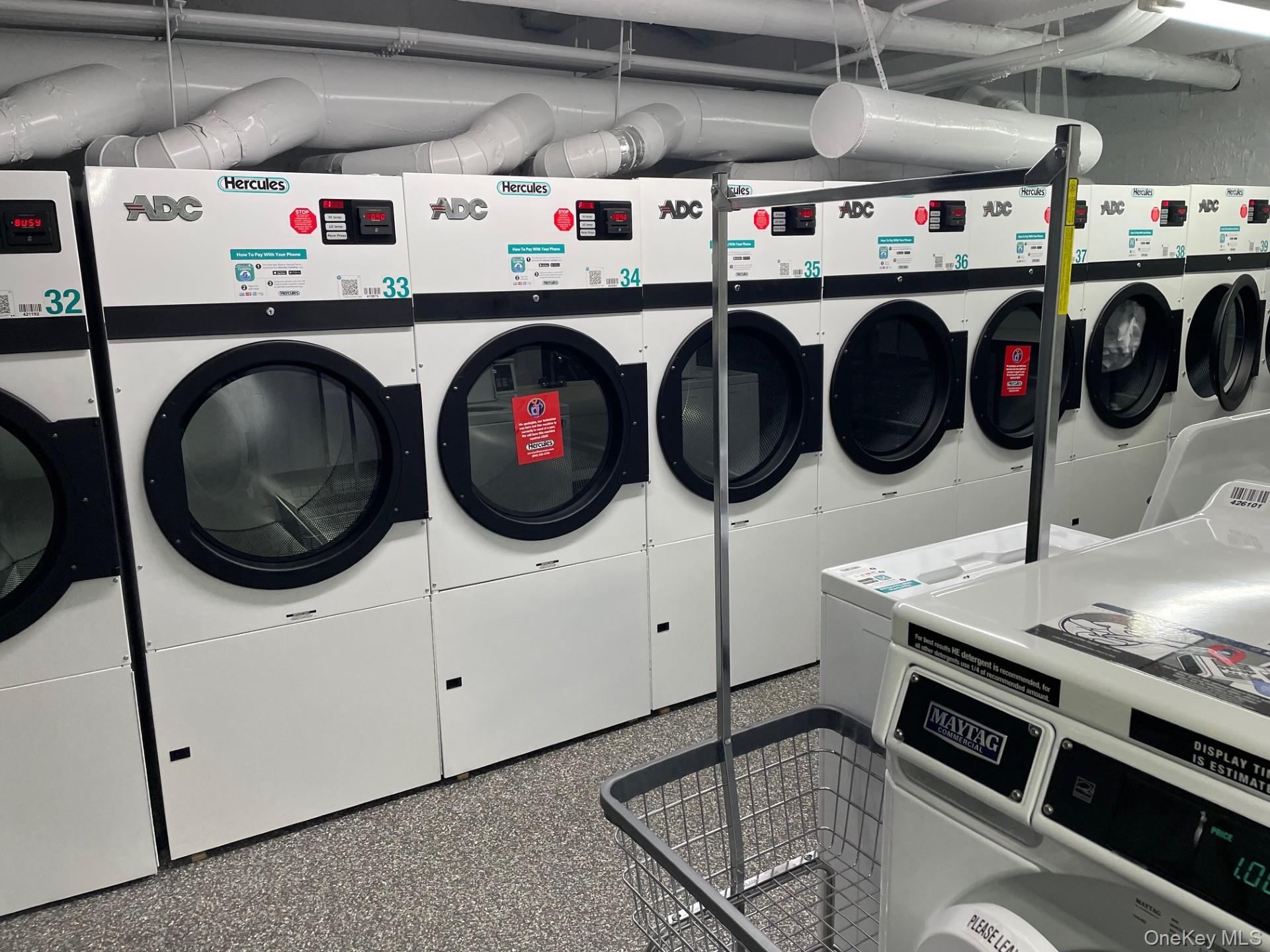192 Garth Road, Unit 4N Scarsdale, NY 10583 - Photo 27 of 32 a utility room with dryer washer and other items
