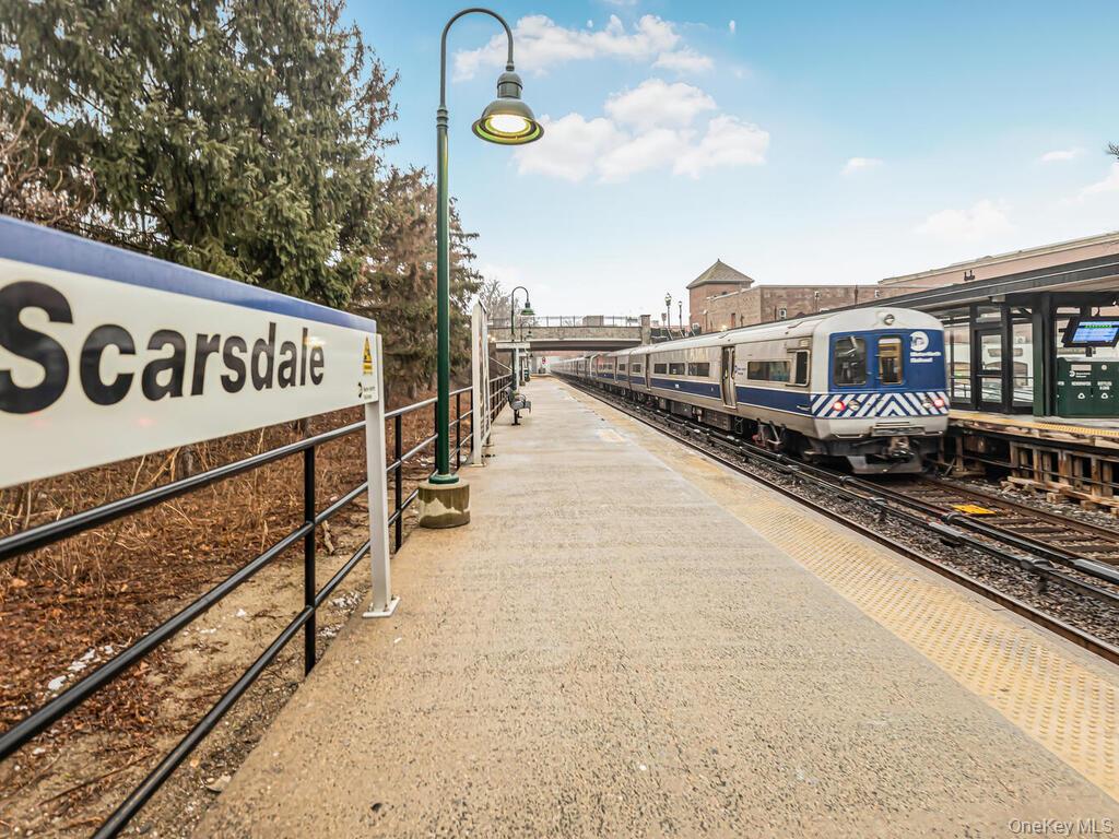 192 Garth Road, Unit 4N Scarsdale, NY 10583 - Photo 30 of 32 a view of a street with wooden fence