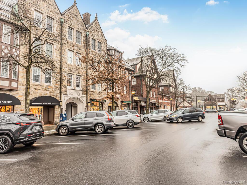 192 Garth Road, Unit 4N Scarsdale, NY 10583 - Photo 32 of 32 a city street with cars parked in front of it