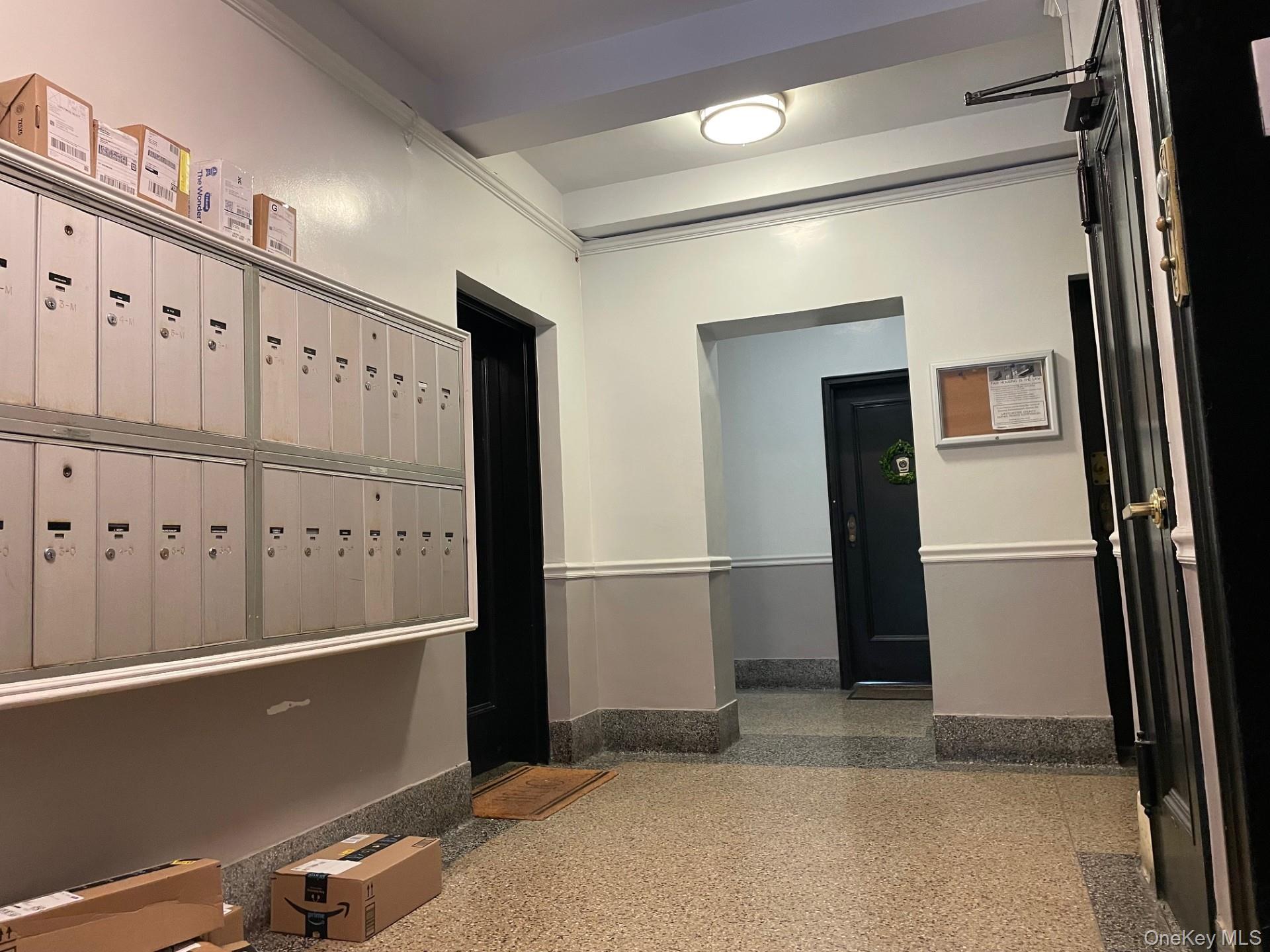 192 Garth Road, Unit 4N Scarsdale, NY 10583 - Photo 4 of 32 a view of a refrigerator in kitchen and an empty room
