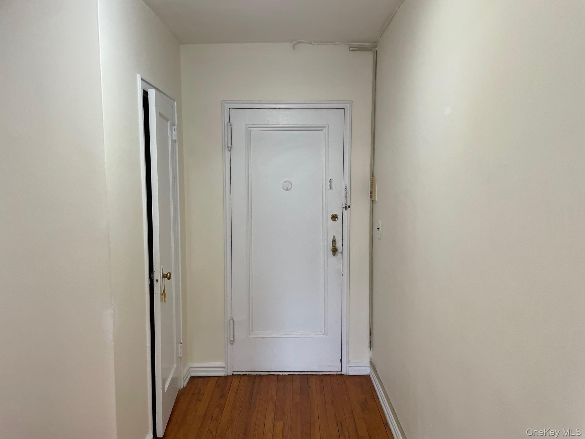 192 Garth Road, Unit 4N Scarsdale, NY 10583 - Photo 7 of 32 a view of front door with wooden floor