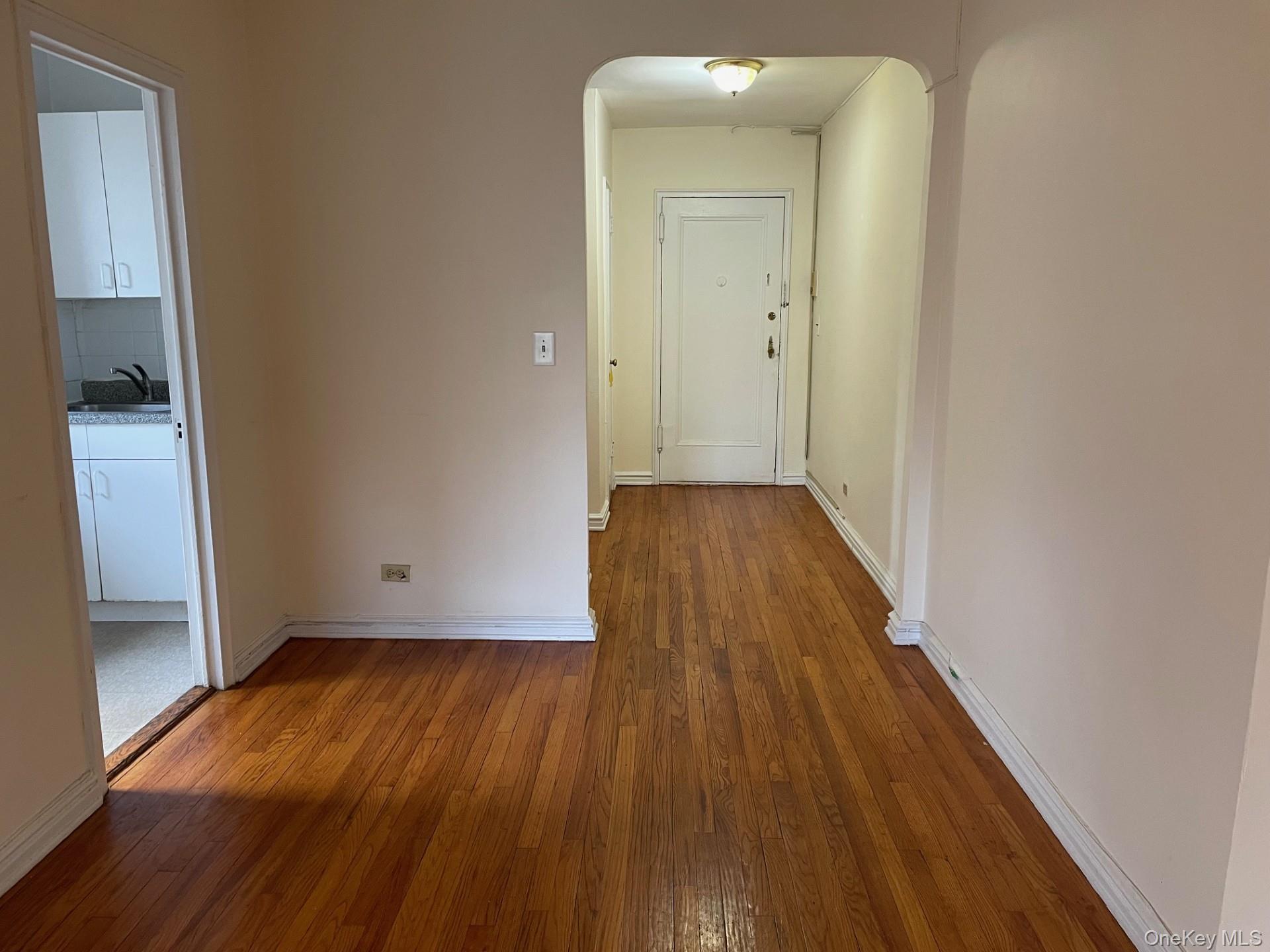 192 Garth Road, Unit 4N Scarsdale, NY 10583 - Photo 9 of 32 a view of a hallway with wooden floor