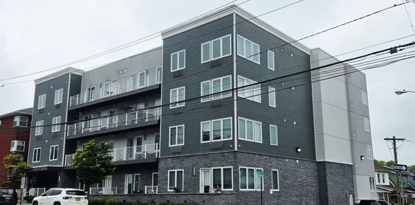 a tall building sitting on the side of a street