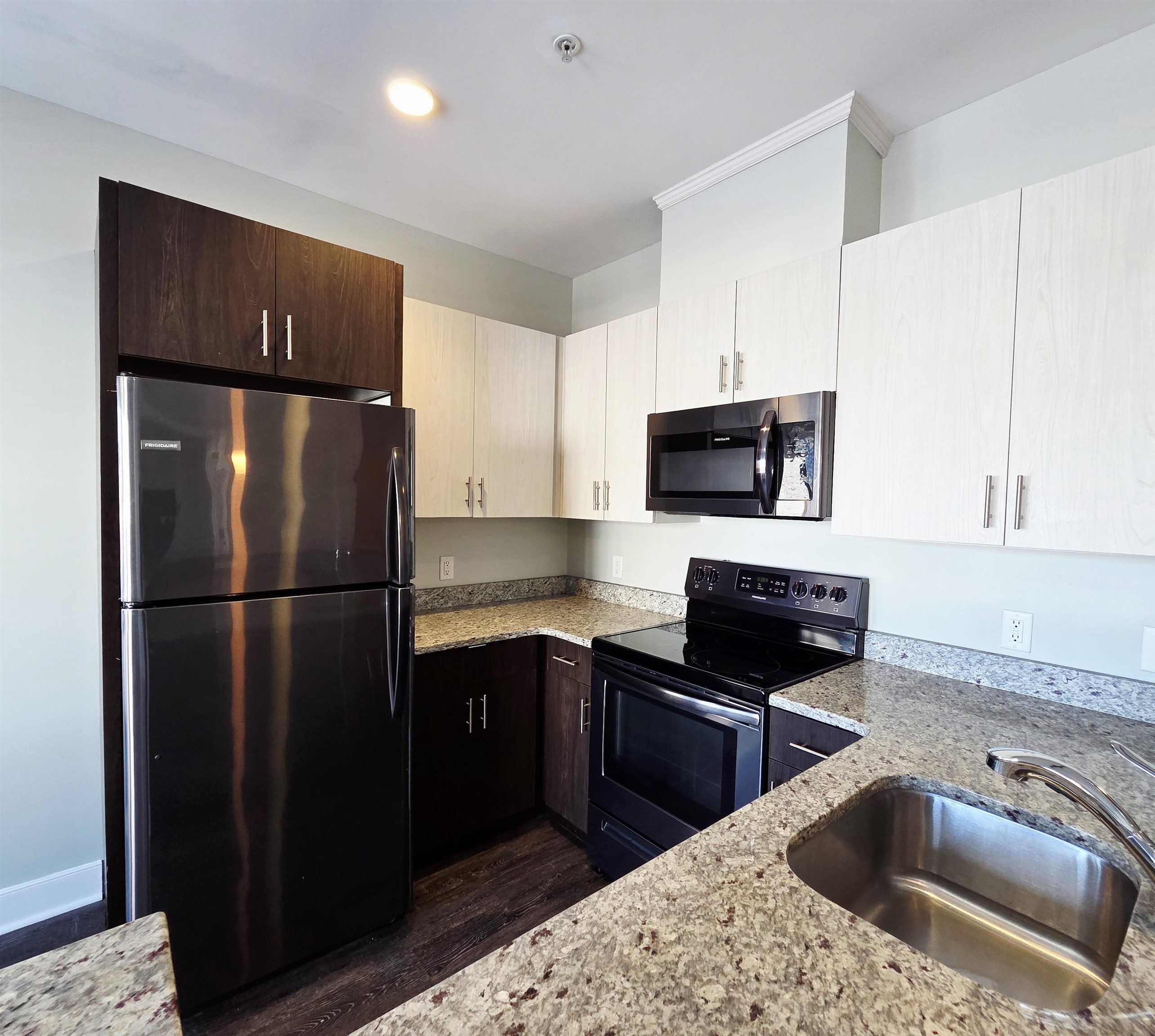 235 Ridge Road, Unit 1G North Arlington, NJ 07031 - Photo 6 of 13 a kitchen with a refrigerator sink and microwave