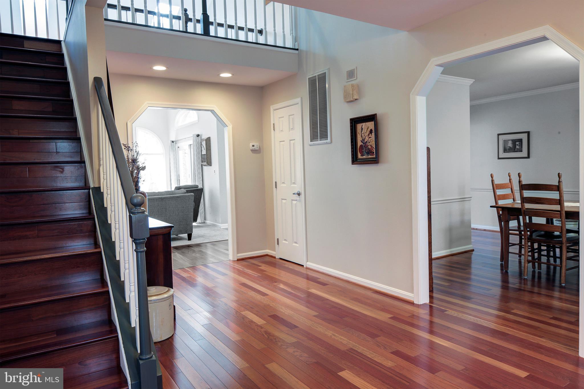 735 Carson Road Huntingtown, MD 20639 - Photo 8 of 37 wooden floor in an empty room with wooden floor and stairs