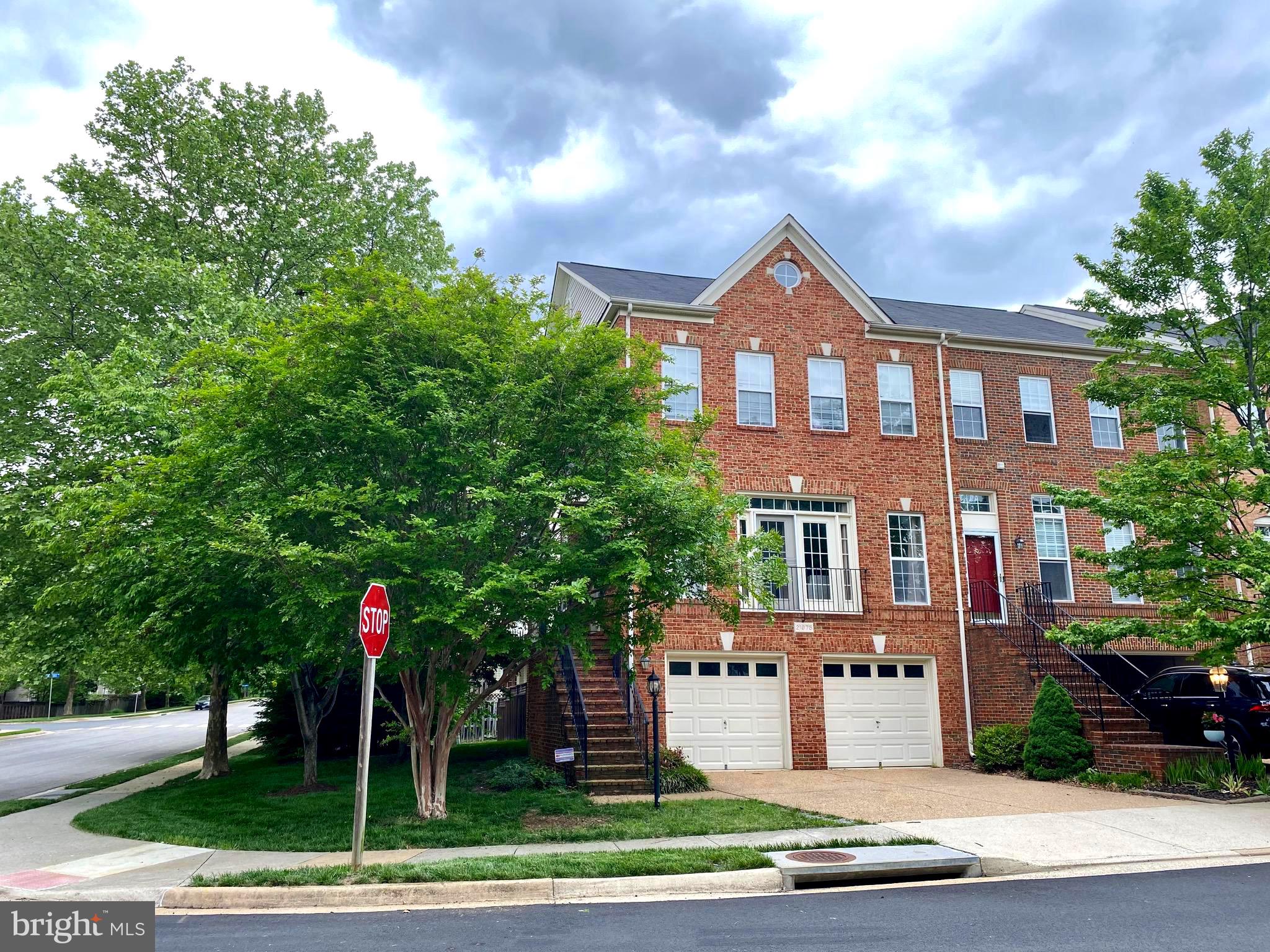 a front view of building with yard