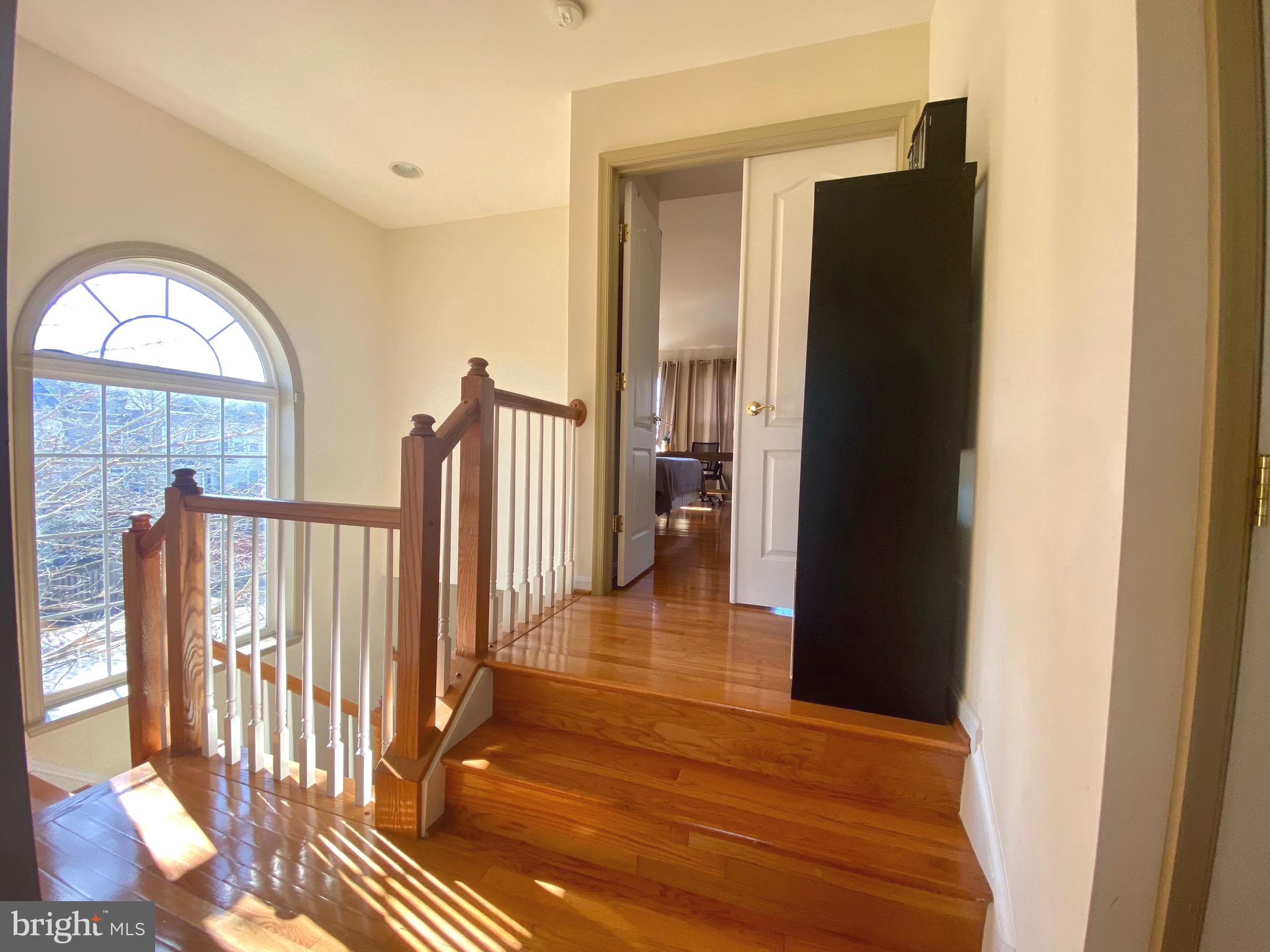 21975 Windover Drive Broadlands, VA 20148 - Photo 13 of 37 a view of a hallway with wooden floor and a living room