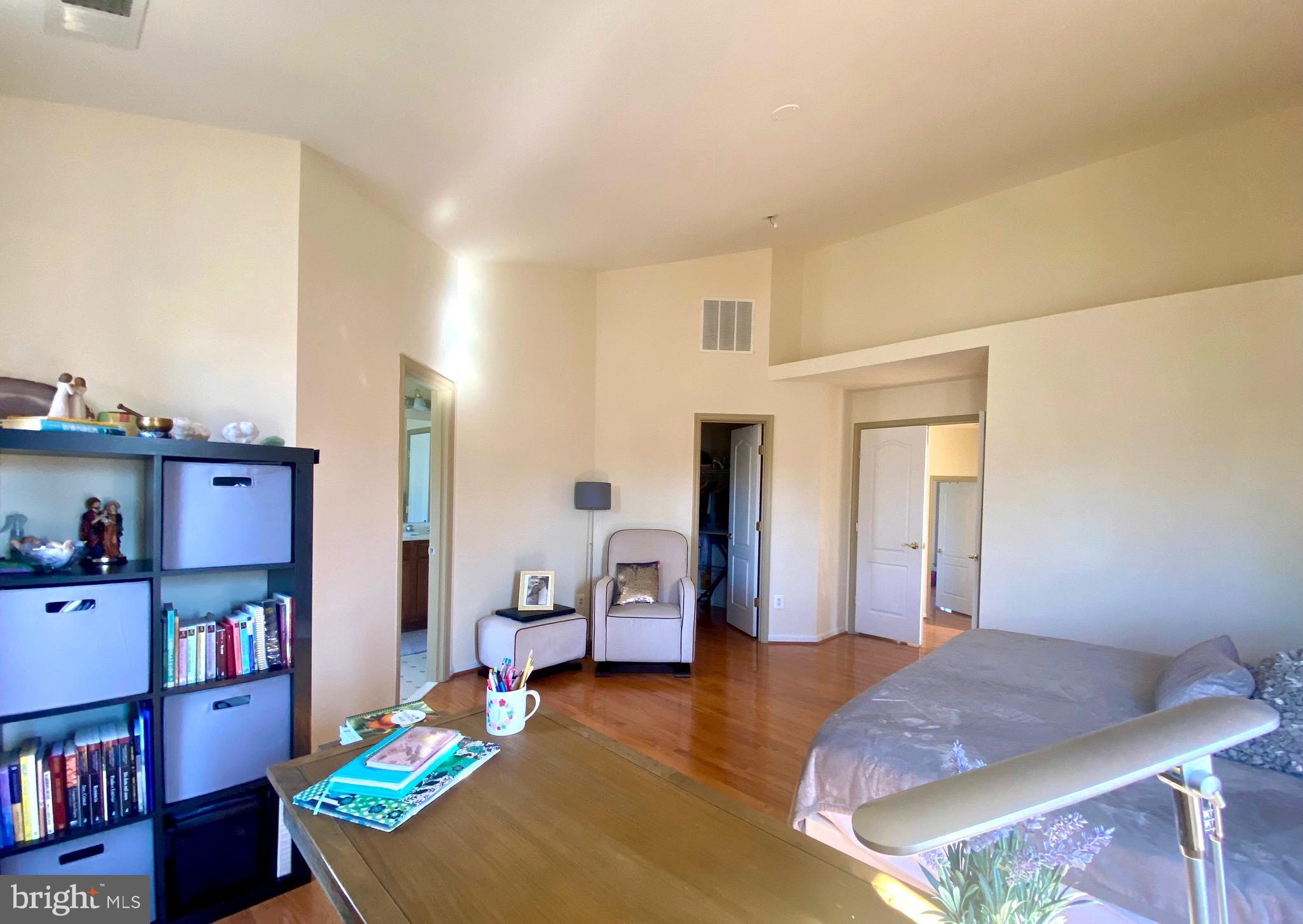 21975 Windover Drive Broadlands, VA 20148 - Photo 19 of 37 a bedroom with furniture and a book shelf