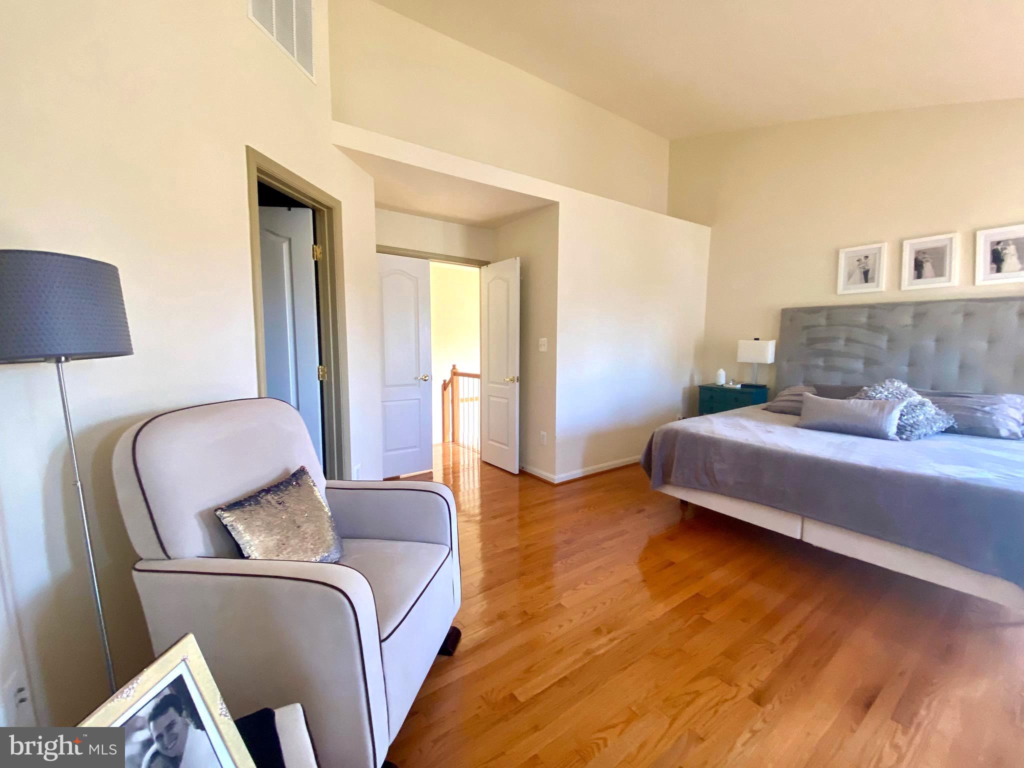 21975 Windover Drive Broadlands, VA 20148 - Photo 21 of 37 a bedroom with a bed and lamp